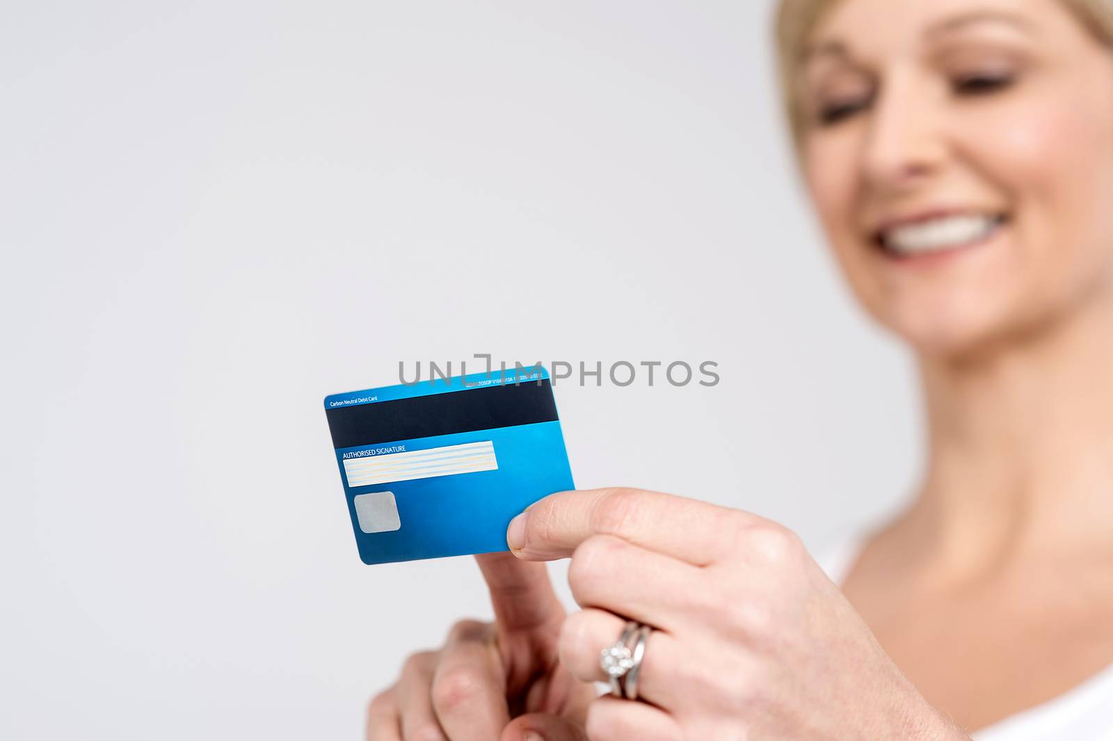 Woman checking her cash card, focus on card