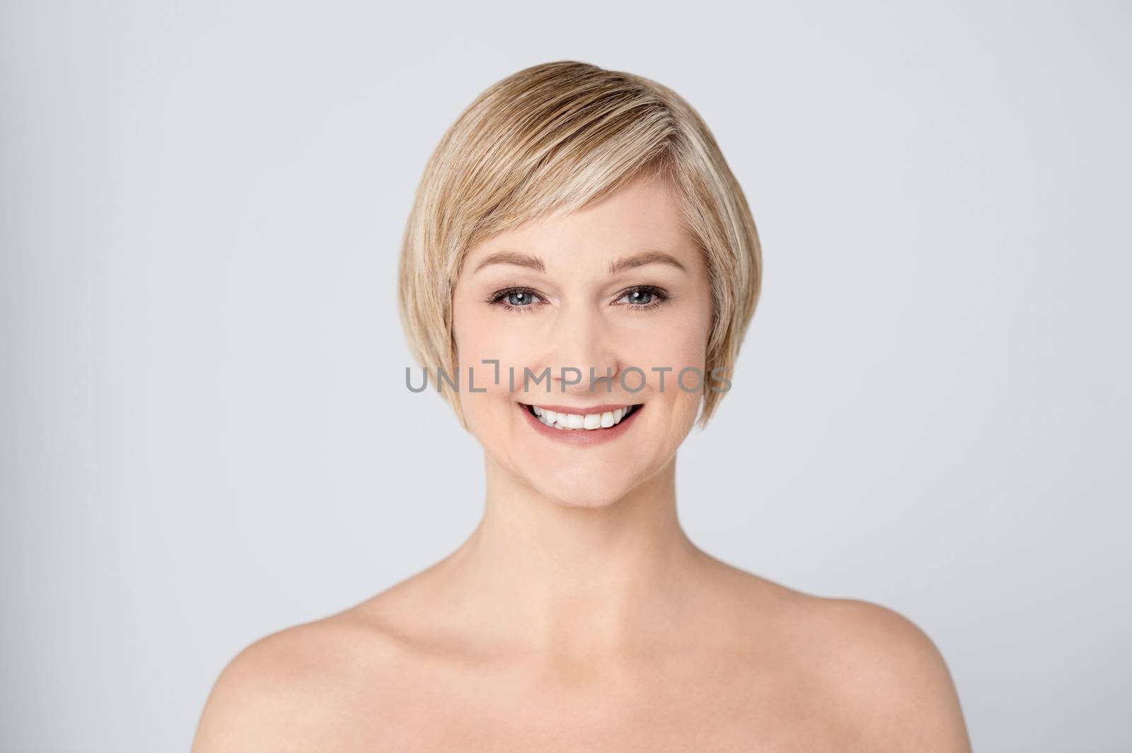 Topless smiling woman posing to camera