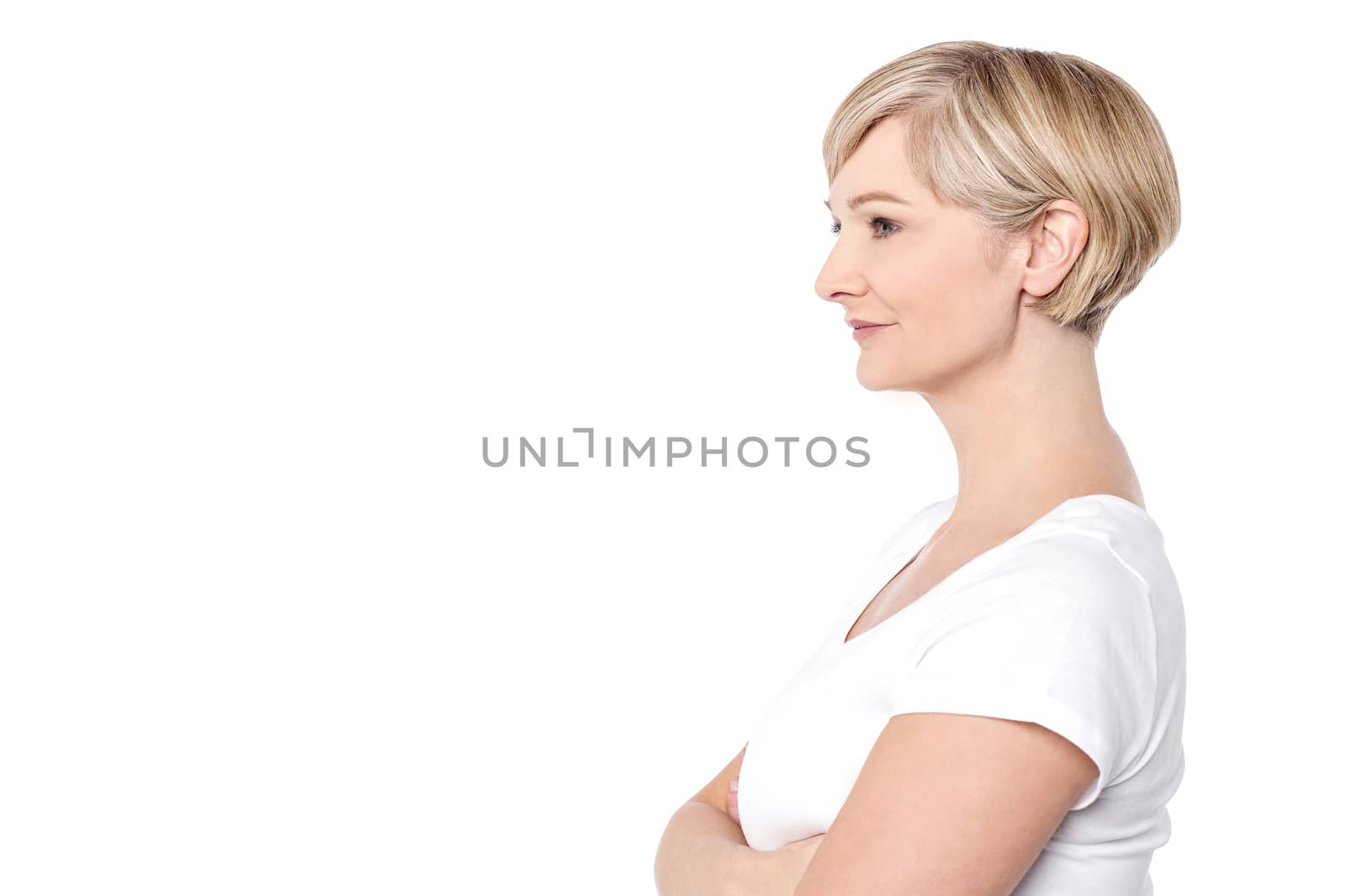 Folded arms mid woman looking at copy space