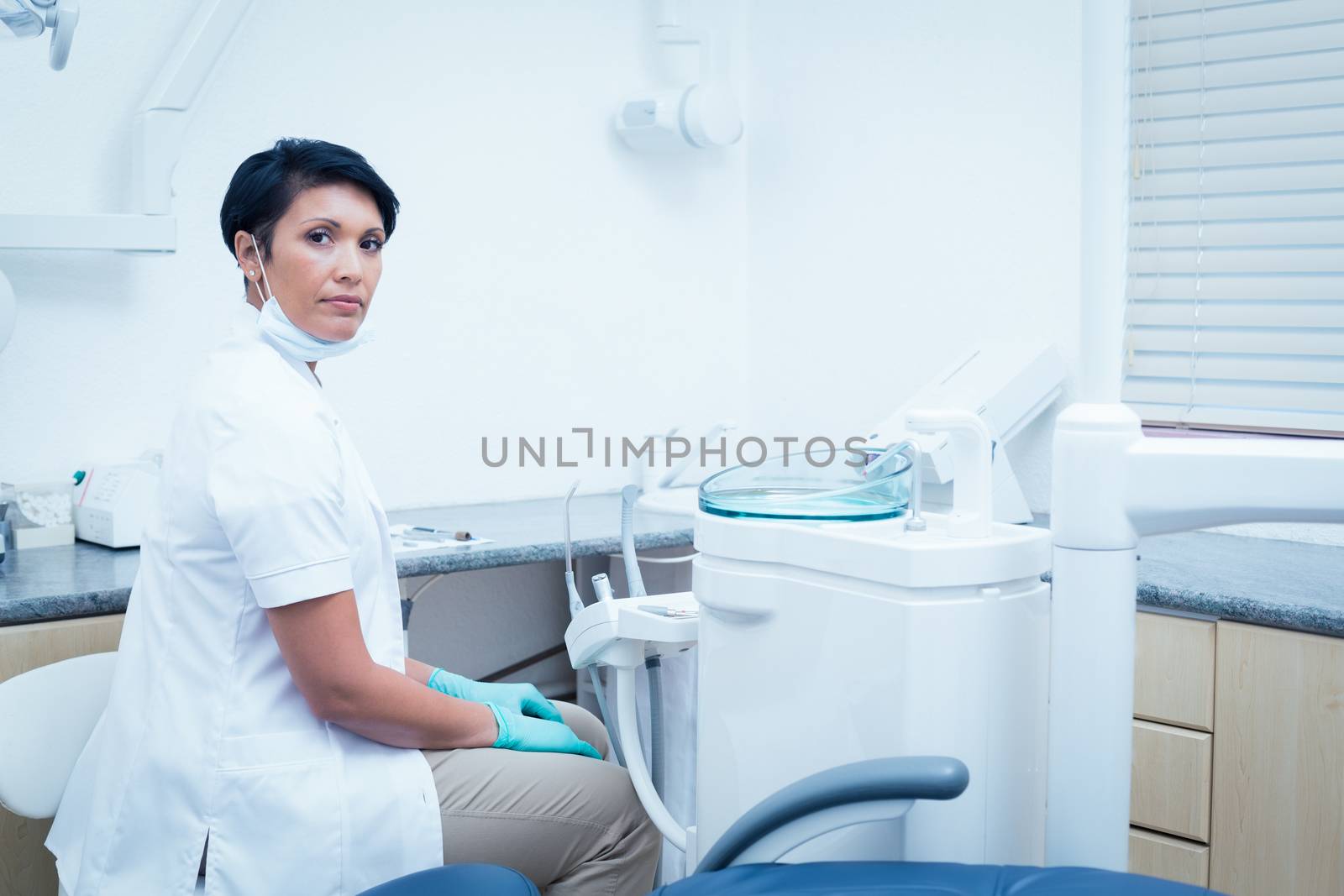 Side view portrait of confident female dentist