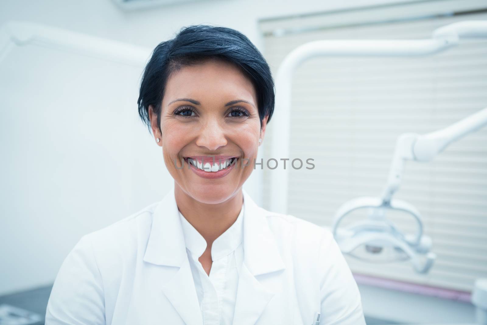 Close up portrait of smiling female dentist