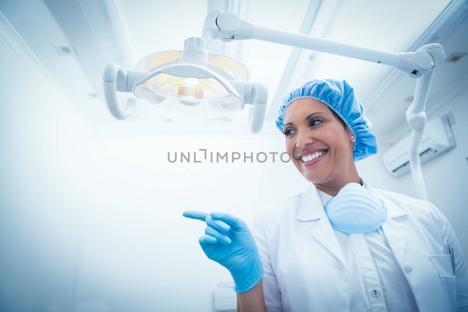 Low angle portrait of smiling female dentist