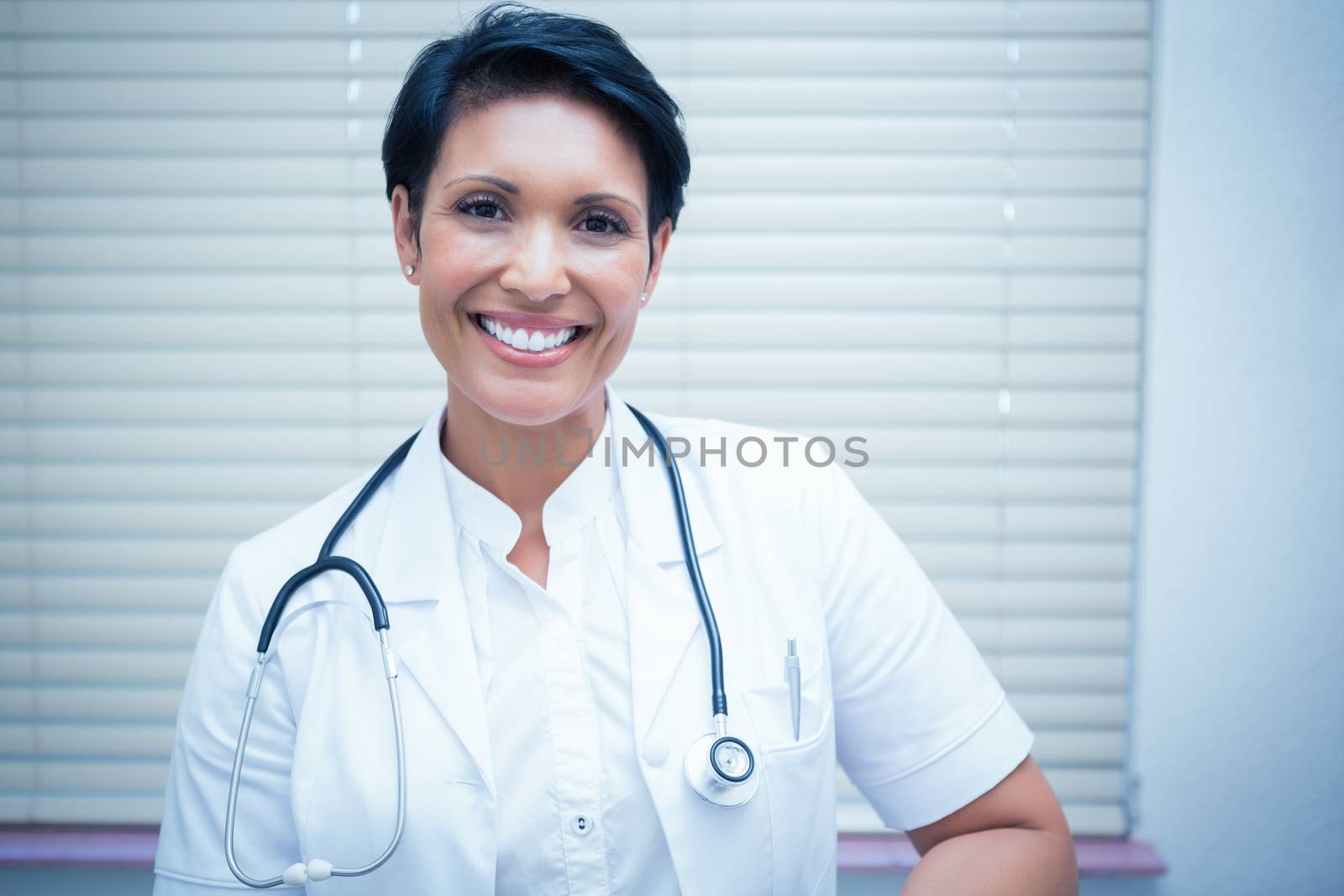 Confident smiling female dentist by Wavebreakmedia