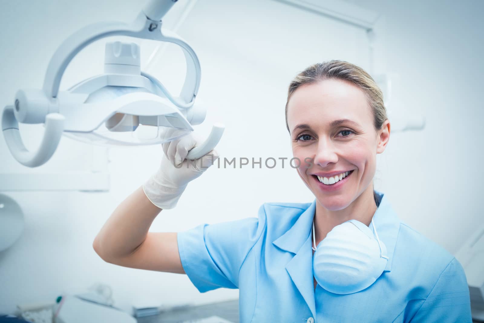 Portrait of female dentist adjusting light by Wavebreakmedia