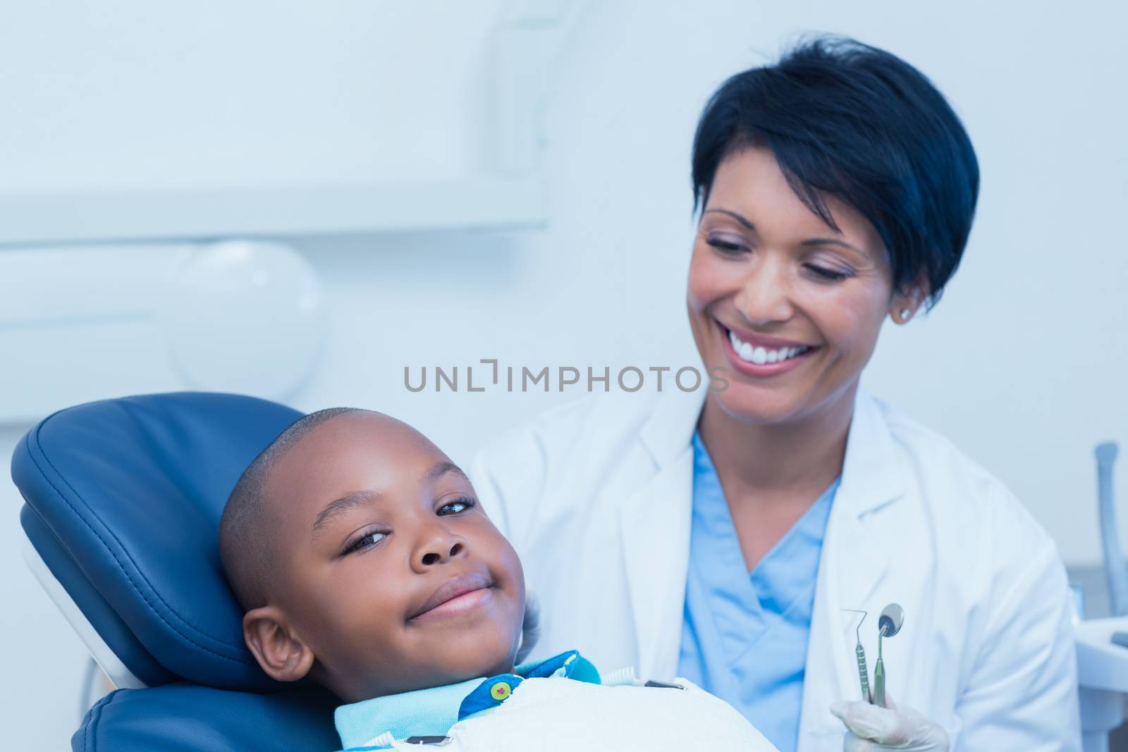 Portrait of smiling boy waiting for a dental exam 