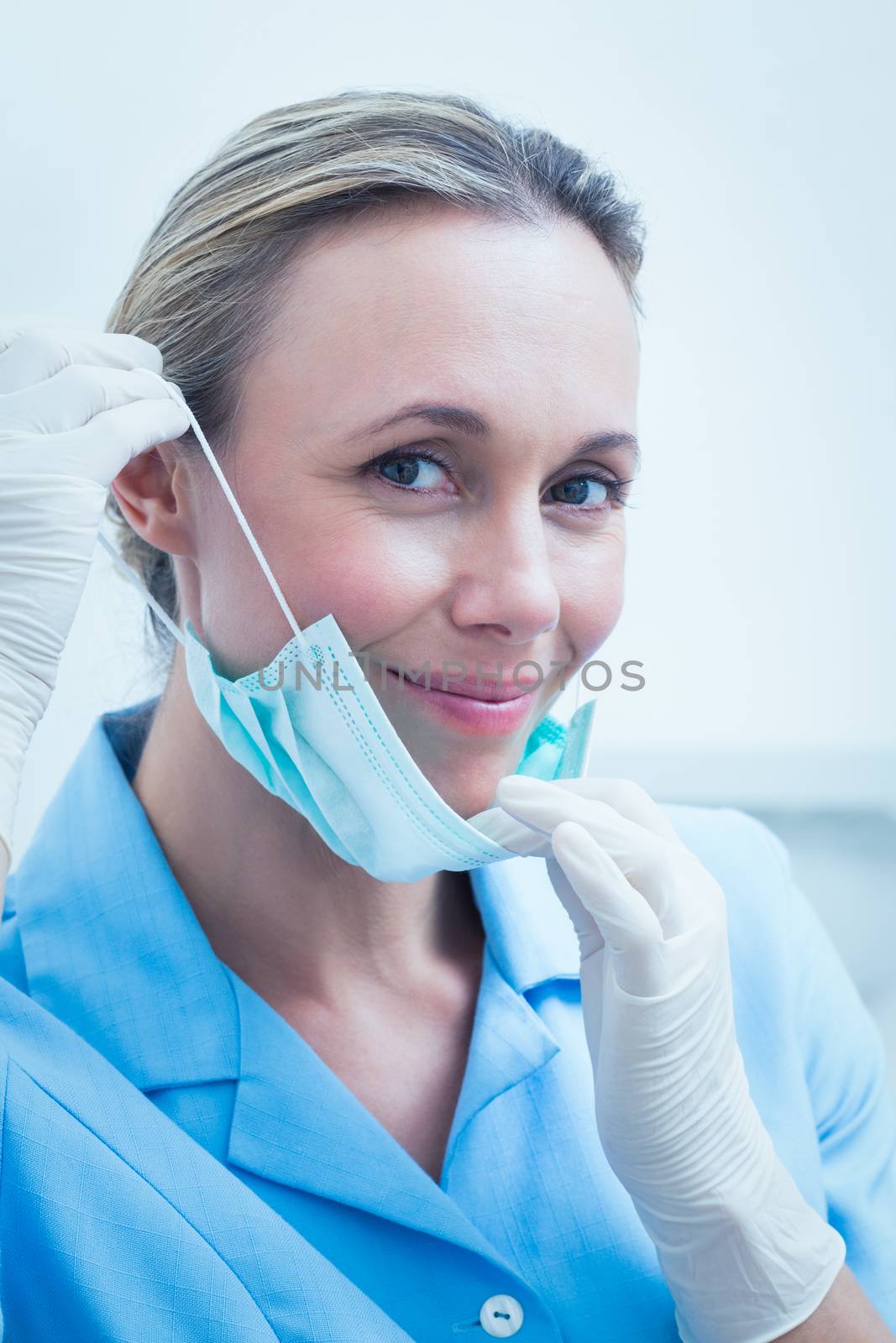 Smiling young female dentist by Wavebreakmedia