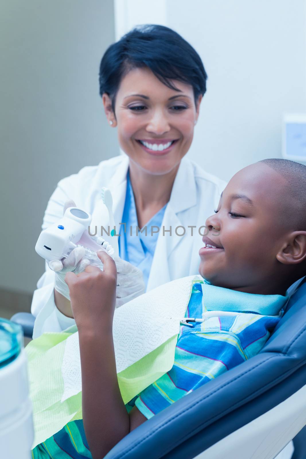 Smiling boy waiting for dental exam by Wavebreakmedia
