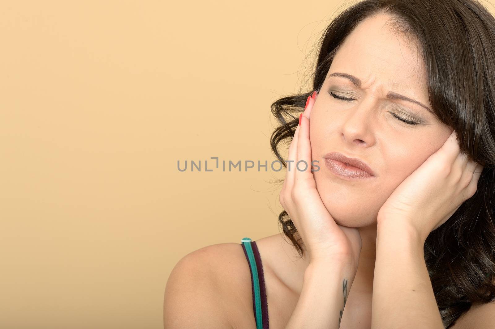 Attractive Young Woman With a Painful Toothache by Whiteboxmedia