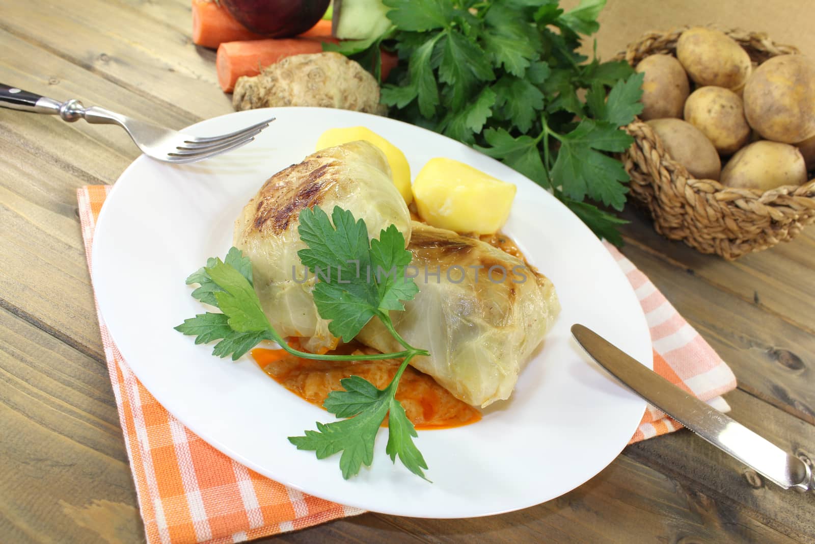 braised cabbage roulade with potatoes and sauce by discovery