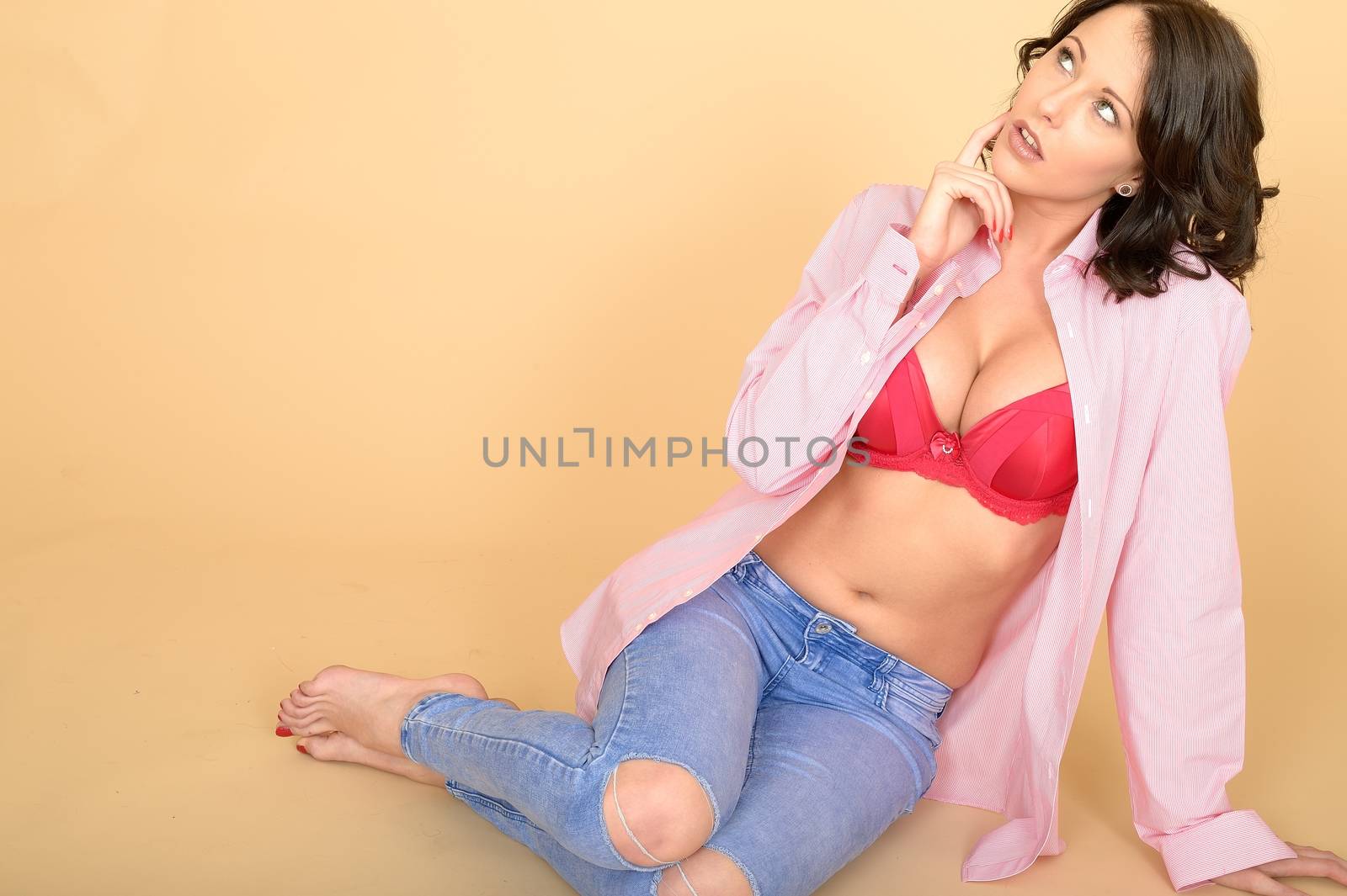 Attractive Young Woman Wearing Jeans and Shirt by Whiteboxmedia
