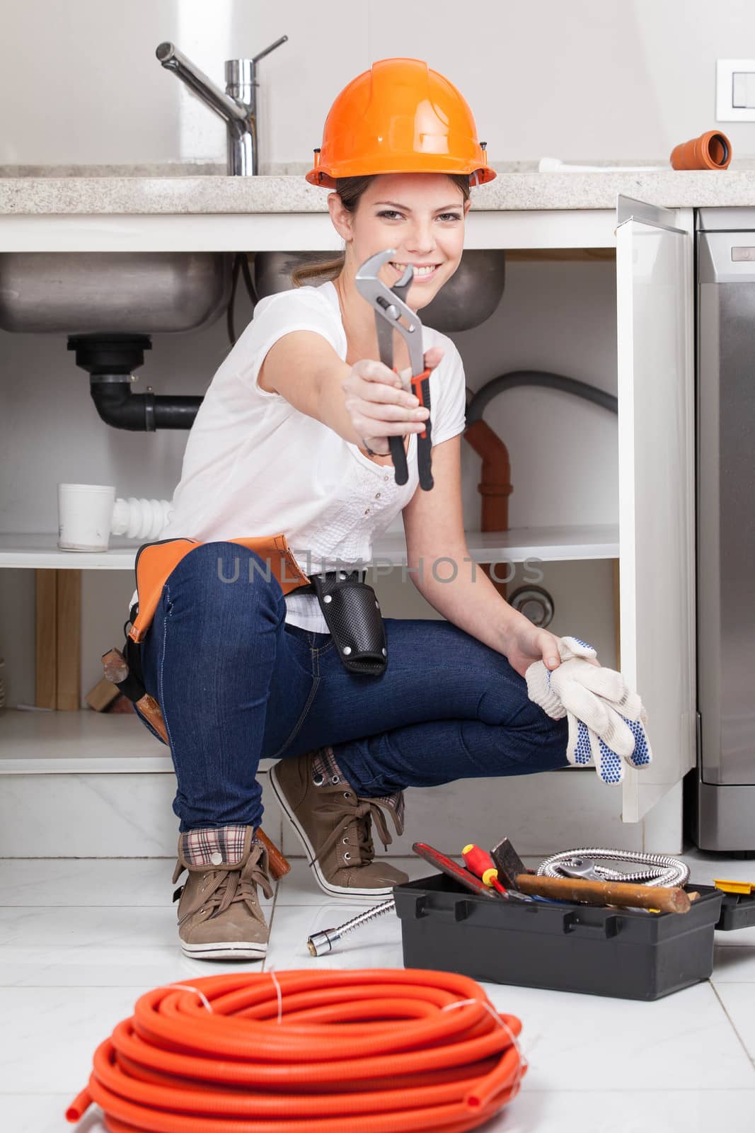 Woman showing a wrench