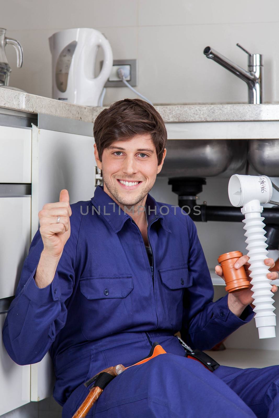 Happy man with his finger up holding a pipes
