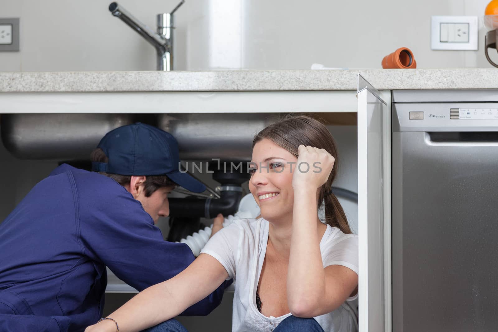 Plumber thinking and smiling