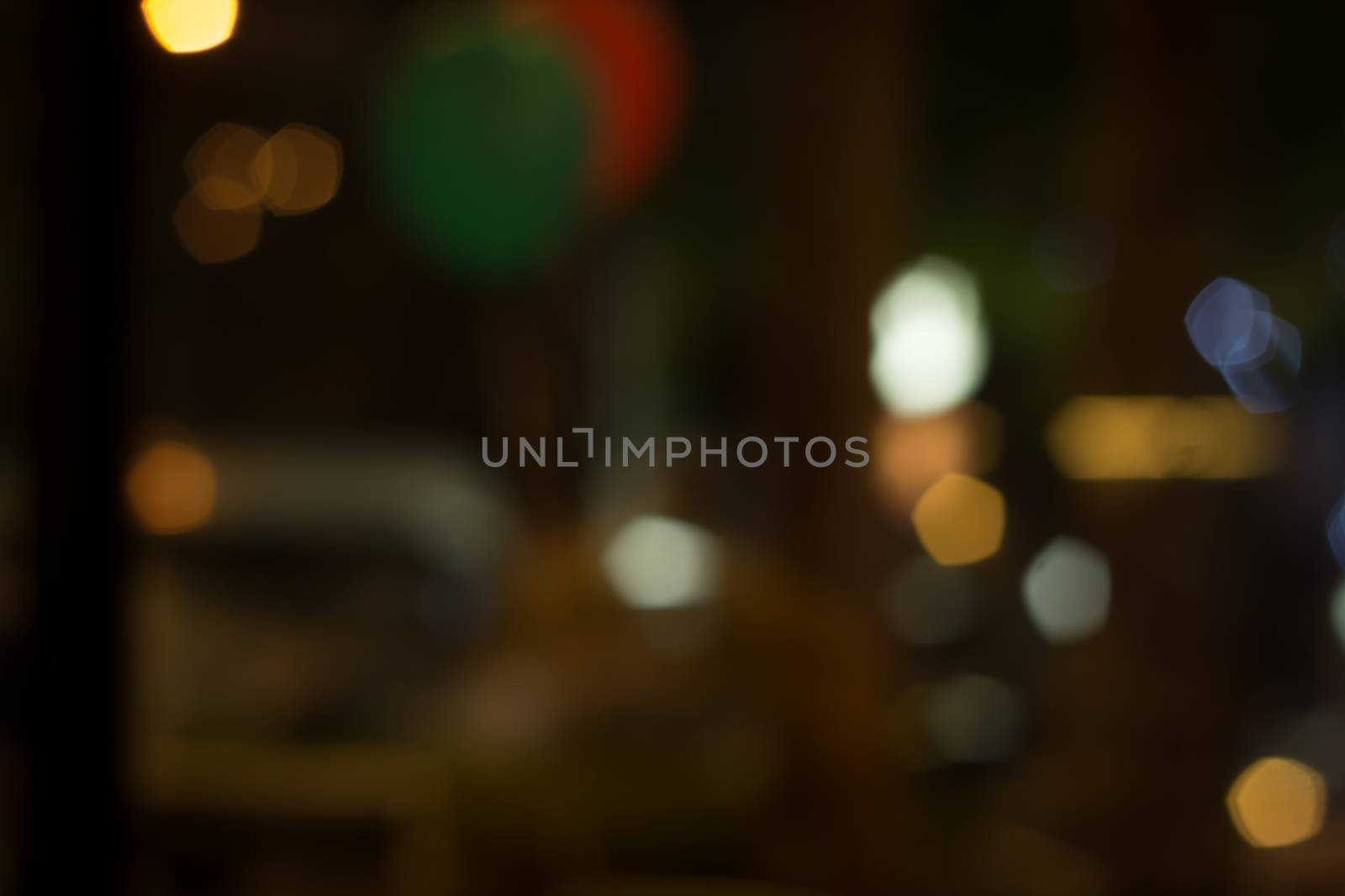 abstract city night light blur bokeh , defocused background by kaisorn