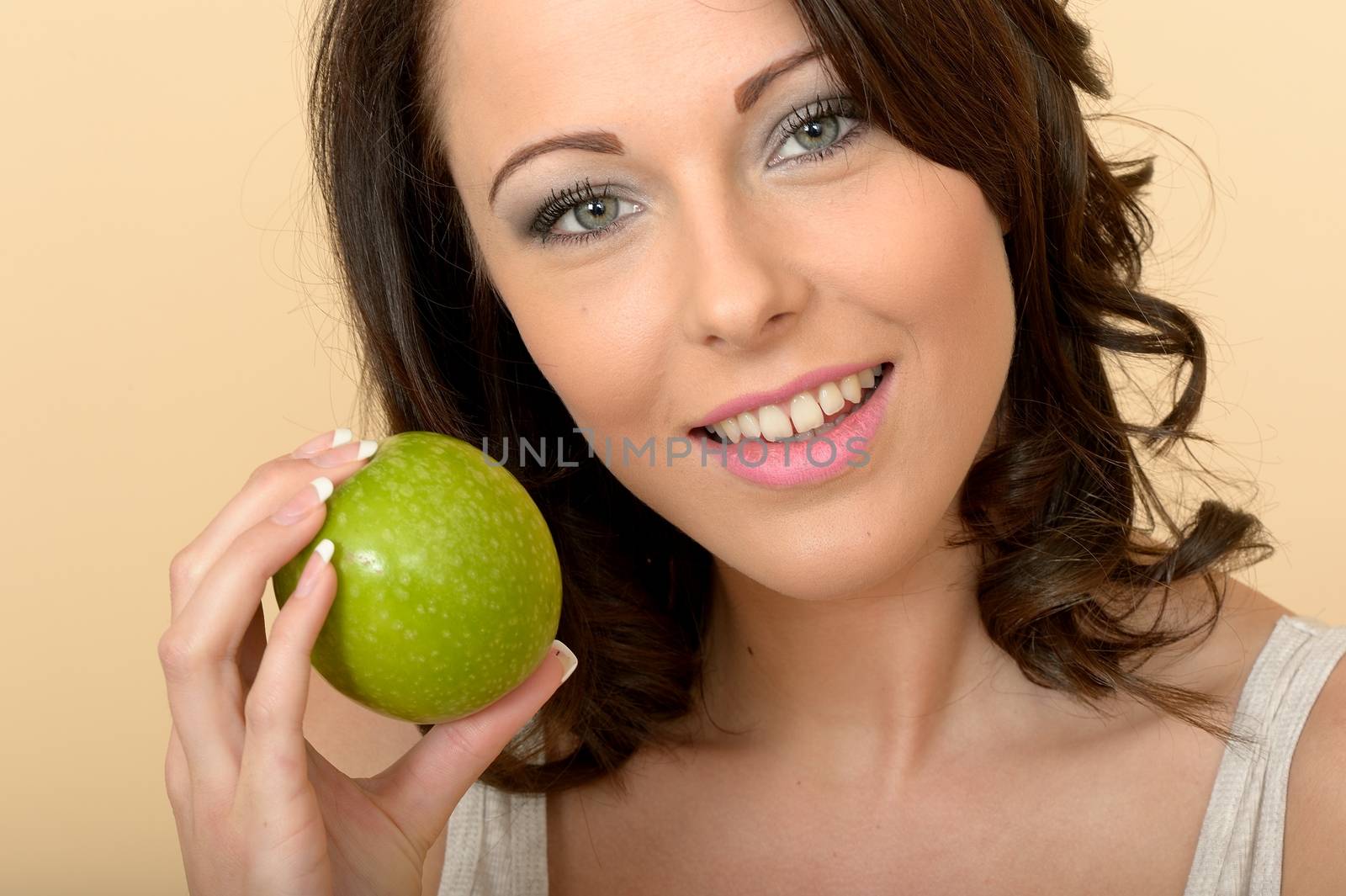 Attractive Beautiful Young Woman Holding a Single Fresh Ripe Juicy Green Apple