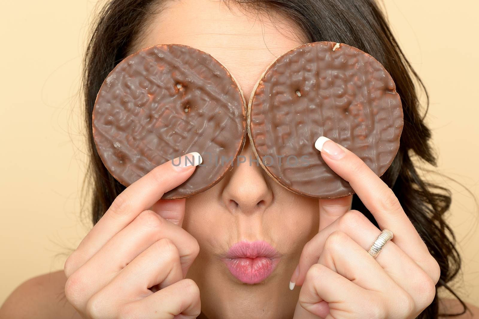 Attractive Beautiful Young Woman Holding Two Milk Chocolate Covered Rice Cake Biscuits