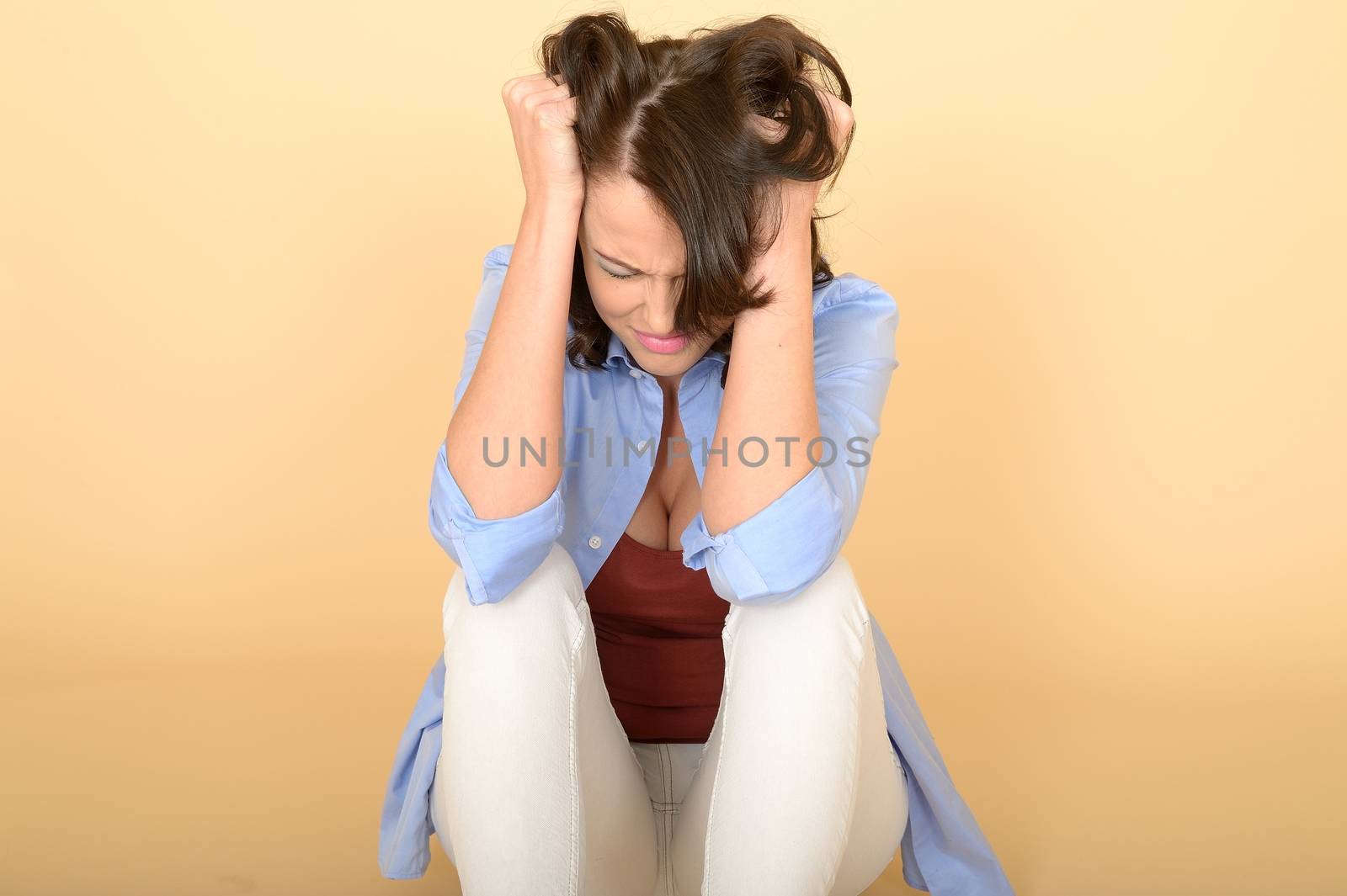 Beautiful Sad Depressed and Angry Young Woman Sitting on the Flo by Whiteboxmedia