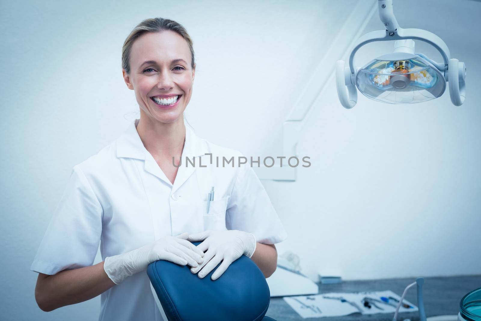 Portrait of smiling young female dentist