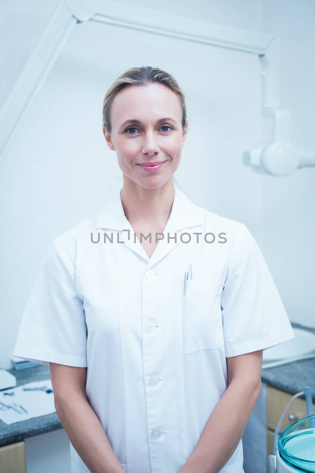 Portrait of smiling young female dentist