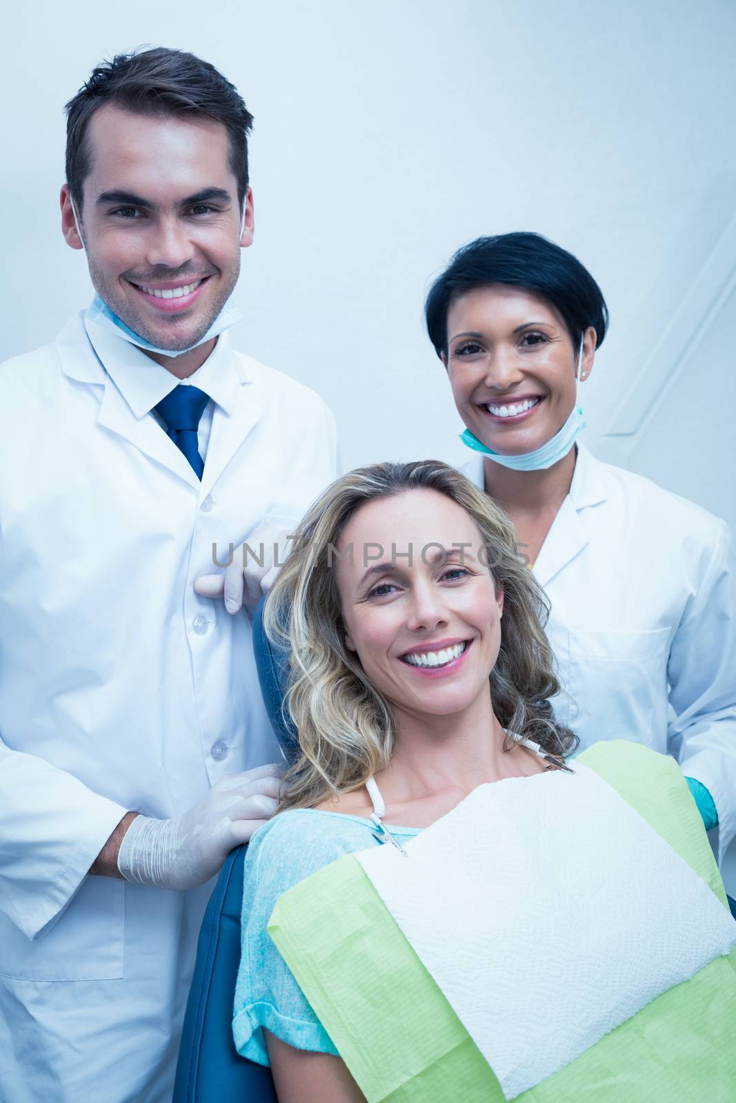 Portrait of dentist with assistant and female patient by Wavebreakmedia