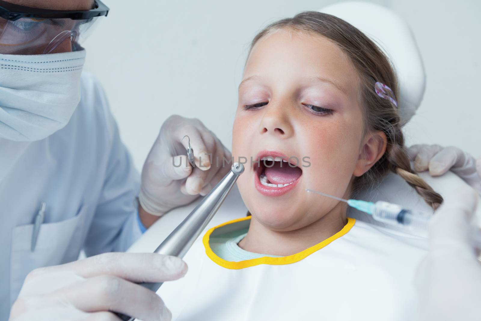 Close up of girl having her teeth examined by Wavebreakmedia