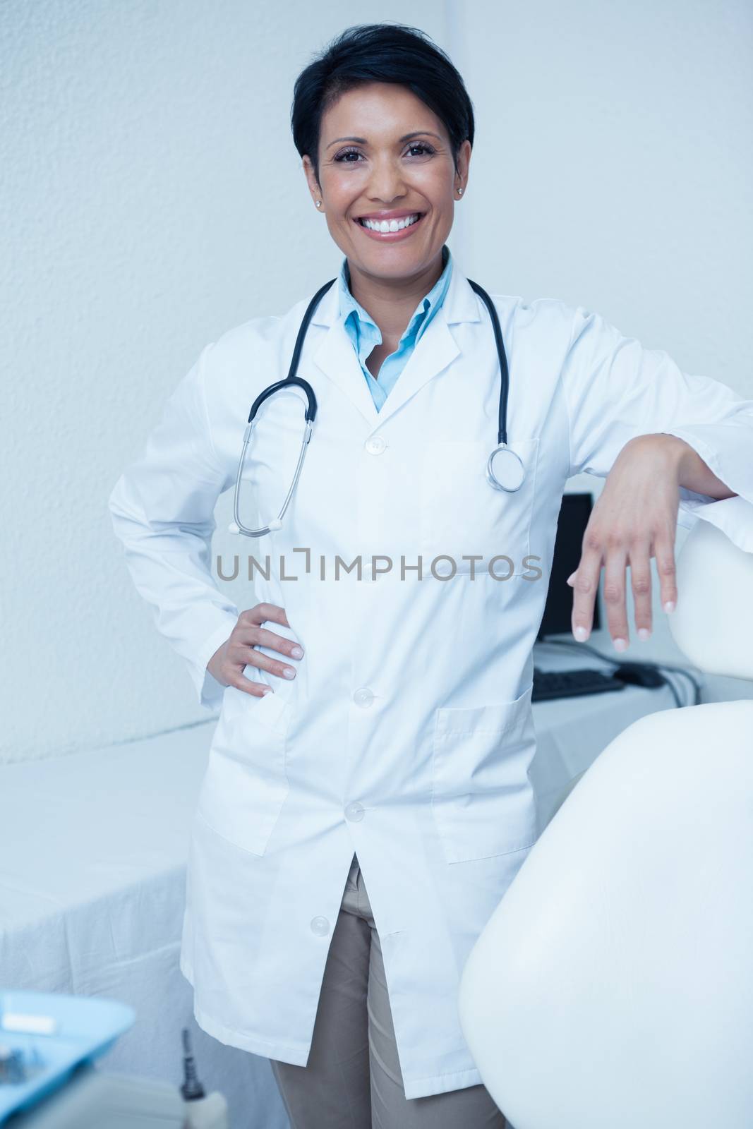 Portrait of smiling female dentist by Wavebreakmedia