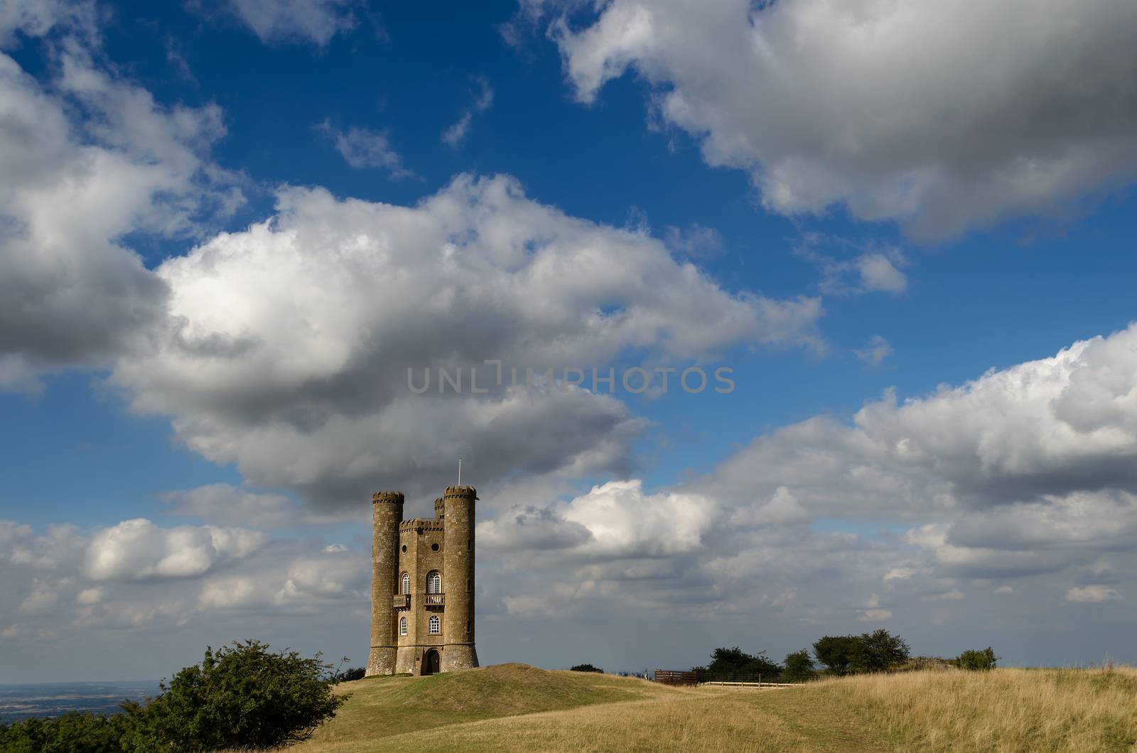Clouds in the sky over Broadway Tower on a hill in the Cotswolds in England, UK.