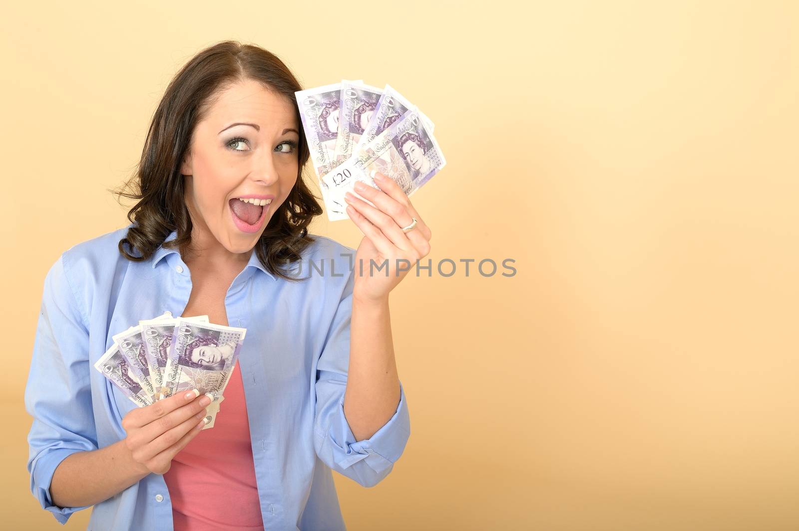 Young Happy Woman Holding Money Looking Pleased and Delighted by Whiteboxmedia