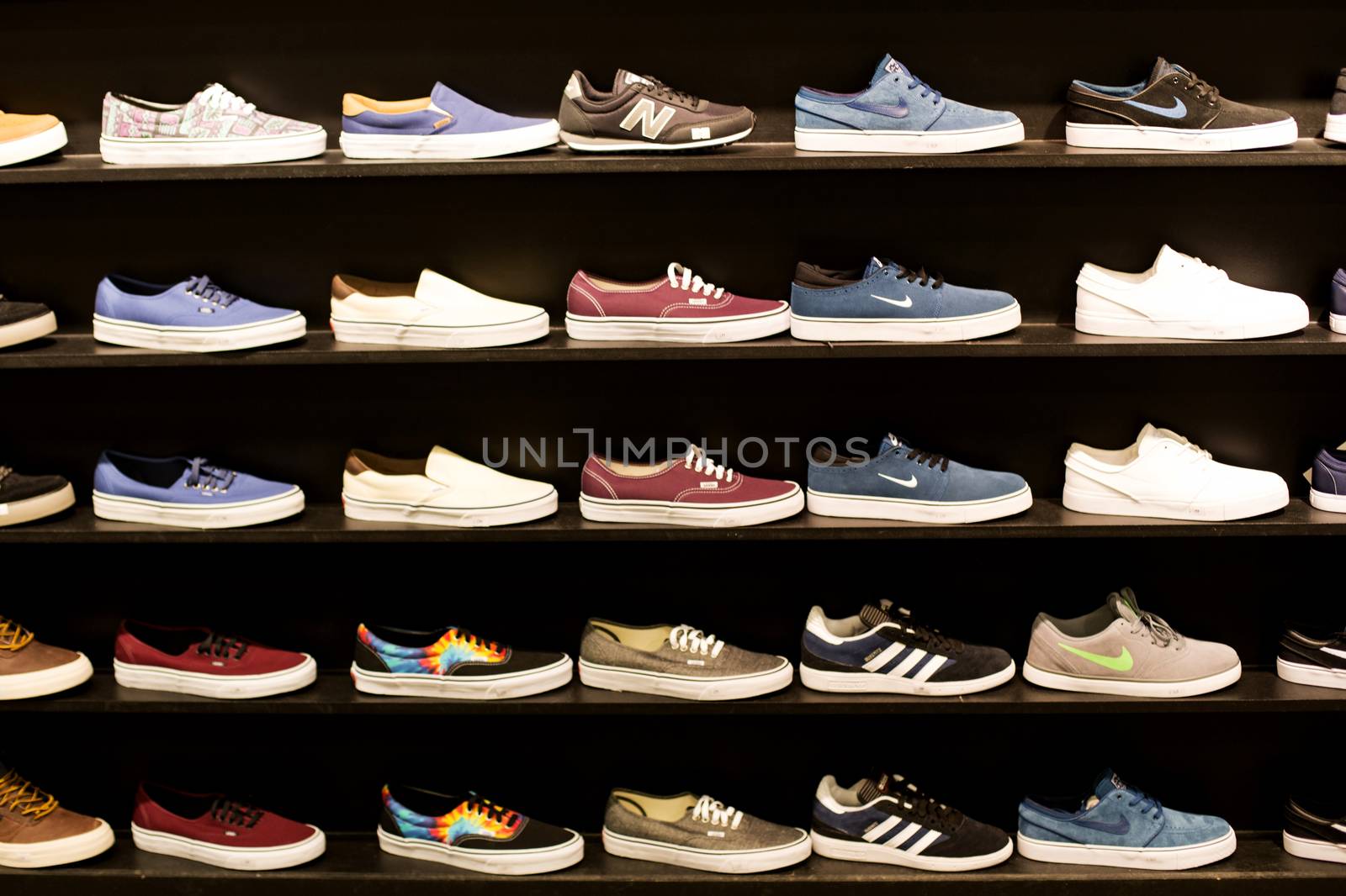 Selection of Colourful Trainers in a Shop Display by Whiteboxmedia