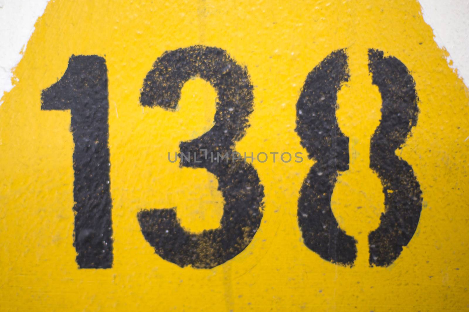 Black Number 138 Painted on a Yellow Triangle Old town Stavanger by Whiteboxmedia