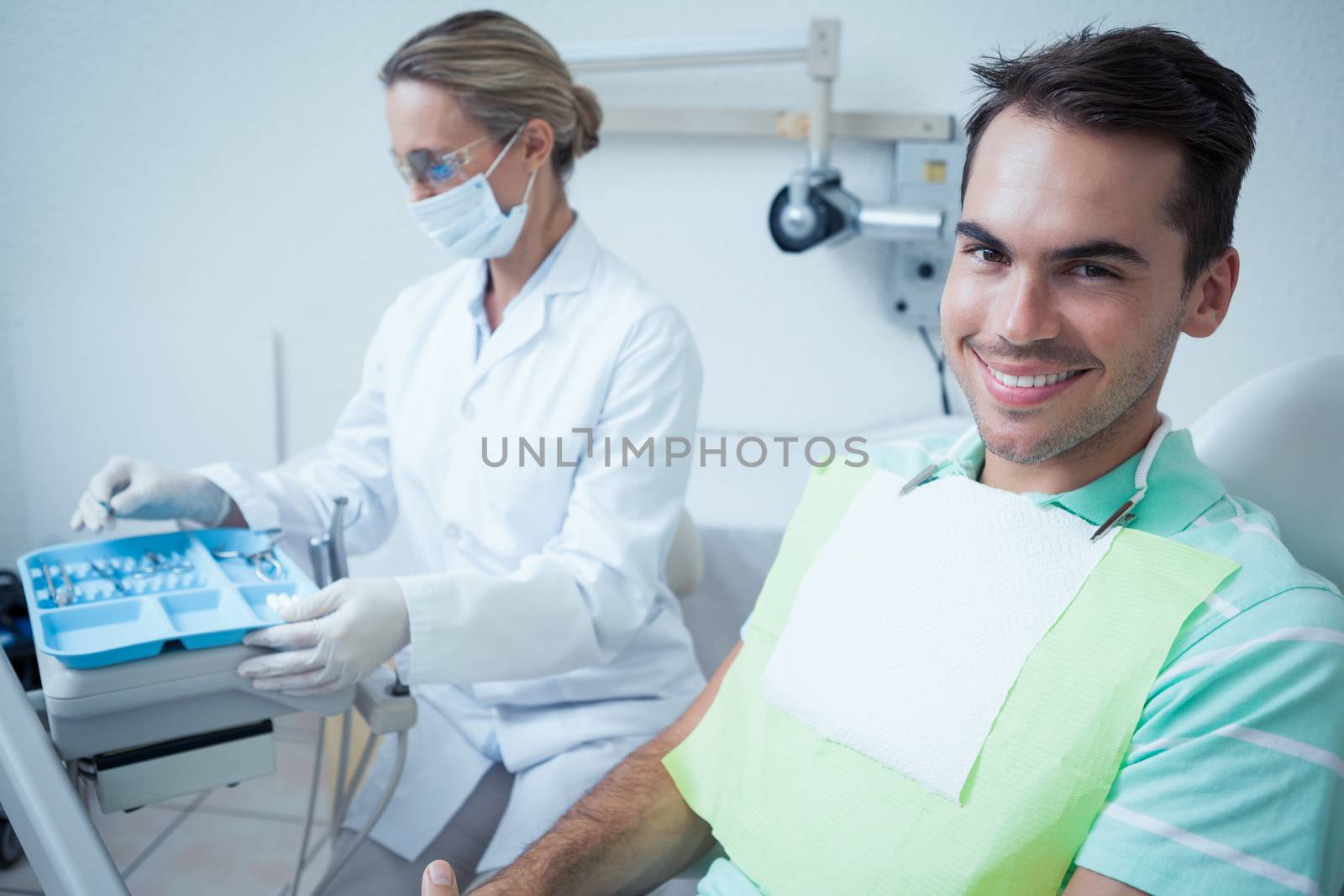 Smiling man waiting for dental exam by Wavebreakmedia