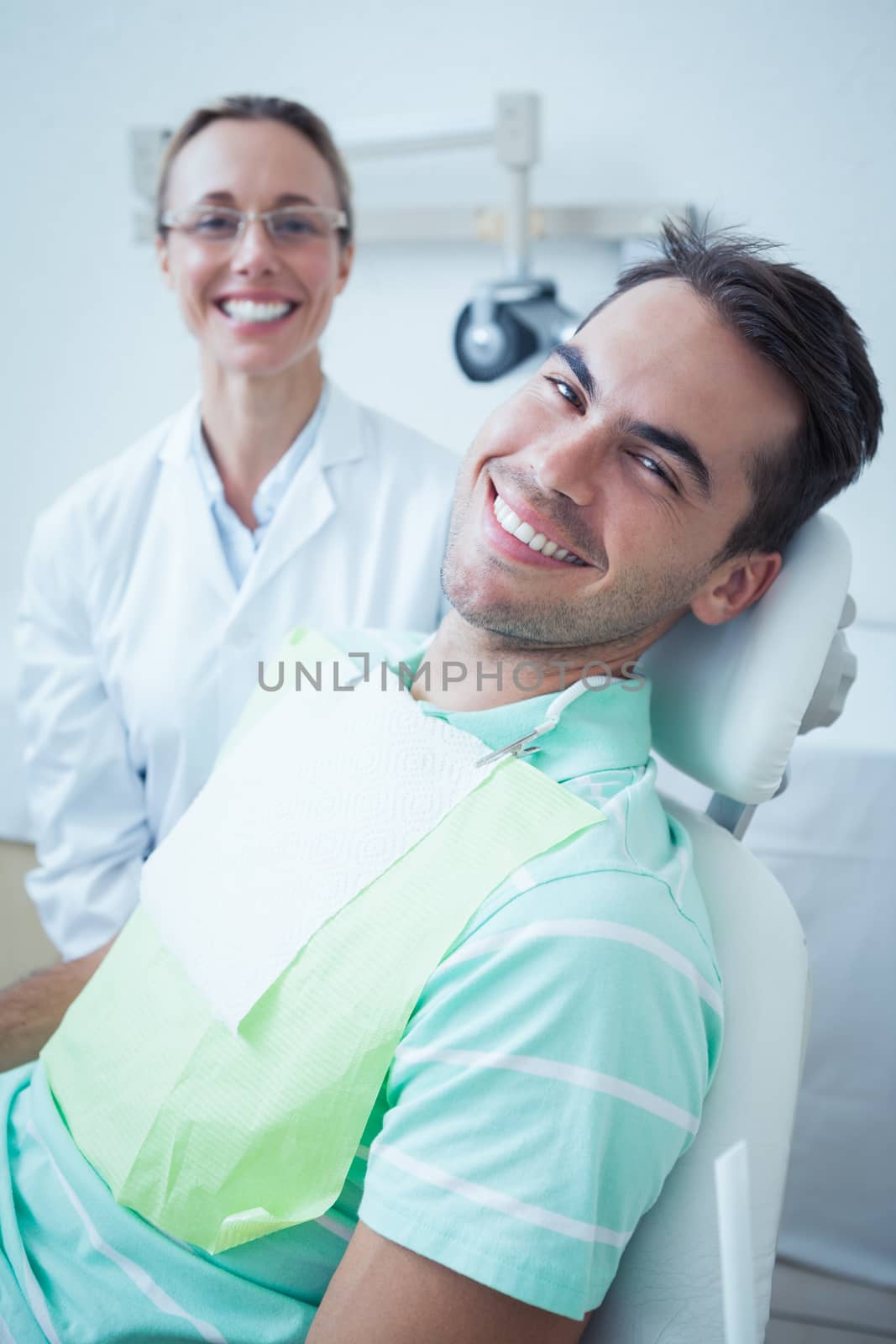 Portrait of smiling young man waiting for a dental exam