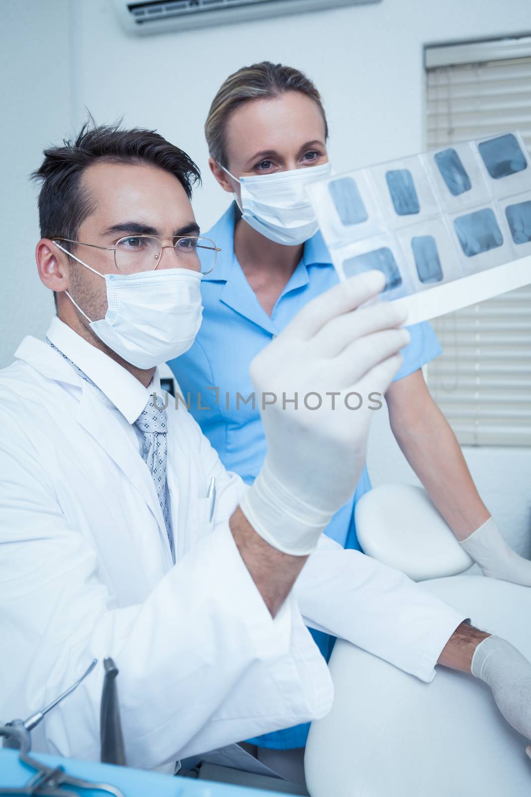 Concentrated two dentists looking at x-ray