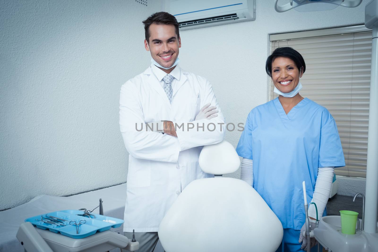 Portrait of smiling male and female dentists