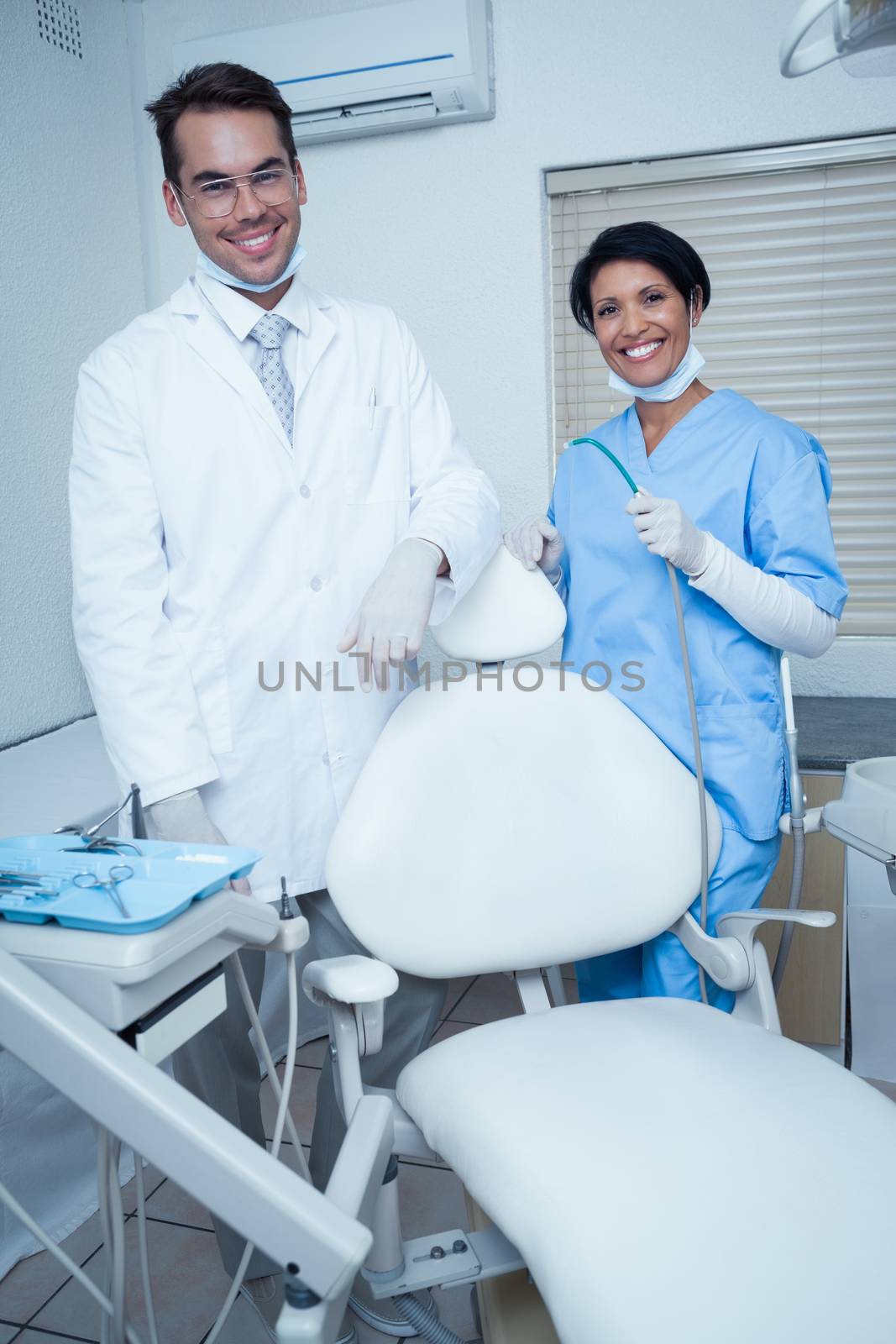 Portrait of smiling male and female dentists