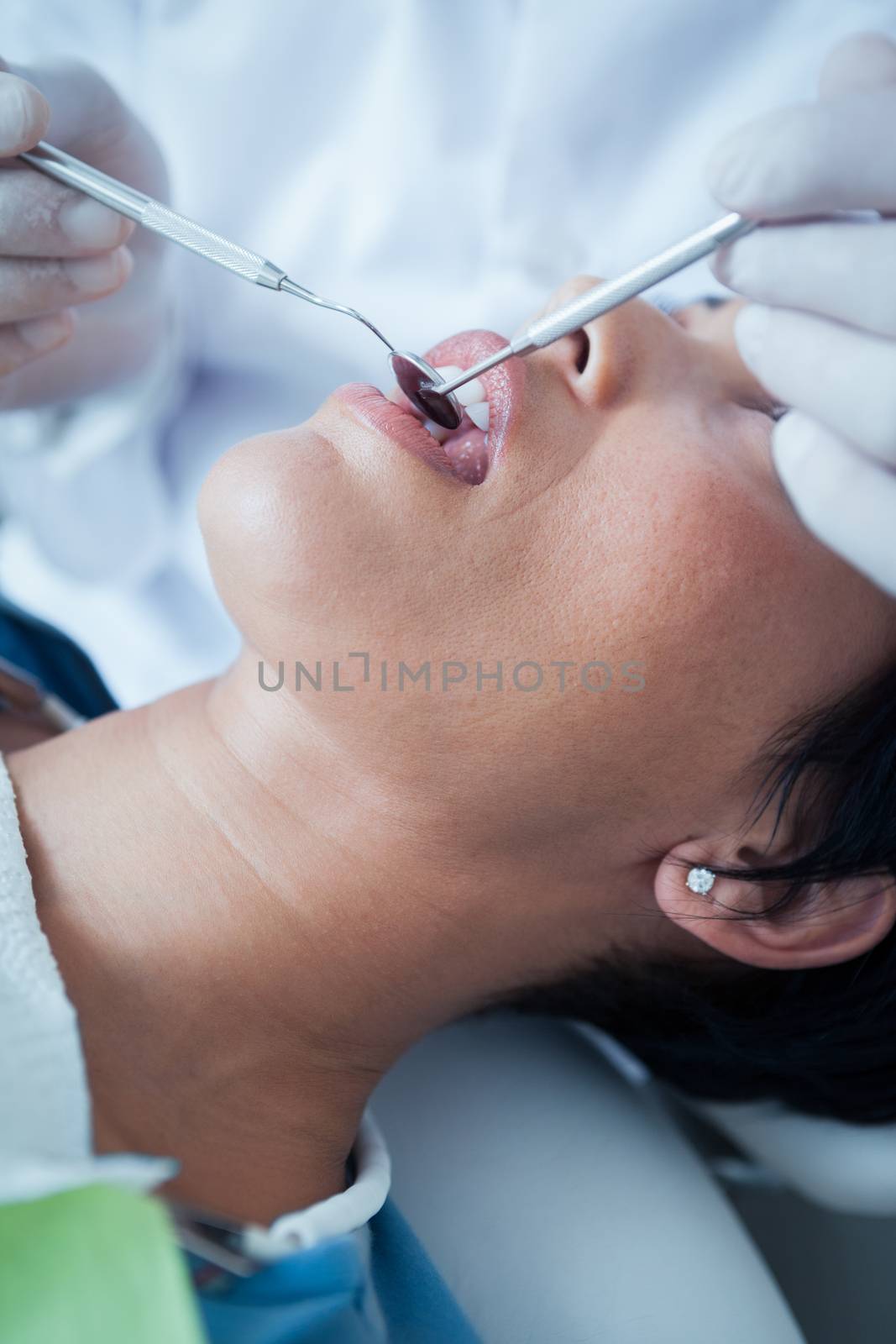 Close up of woman having her teeth examined by Wavebreakmedia