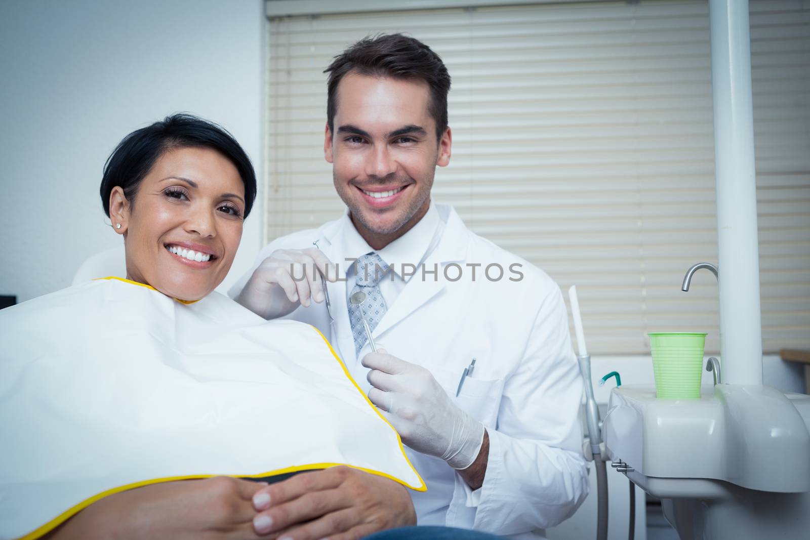 Smiling woman waiting for dental exam by Wavebreakmedia