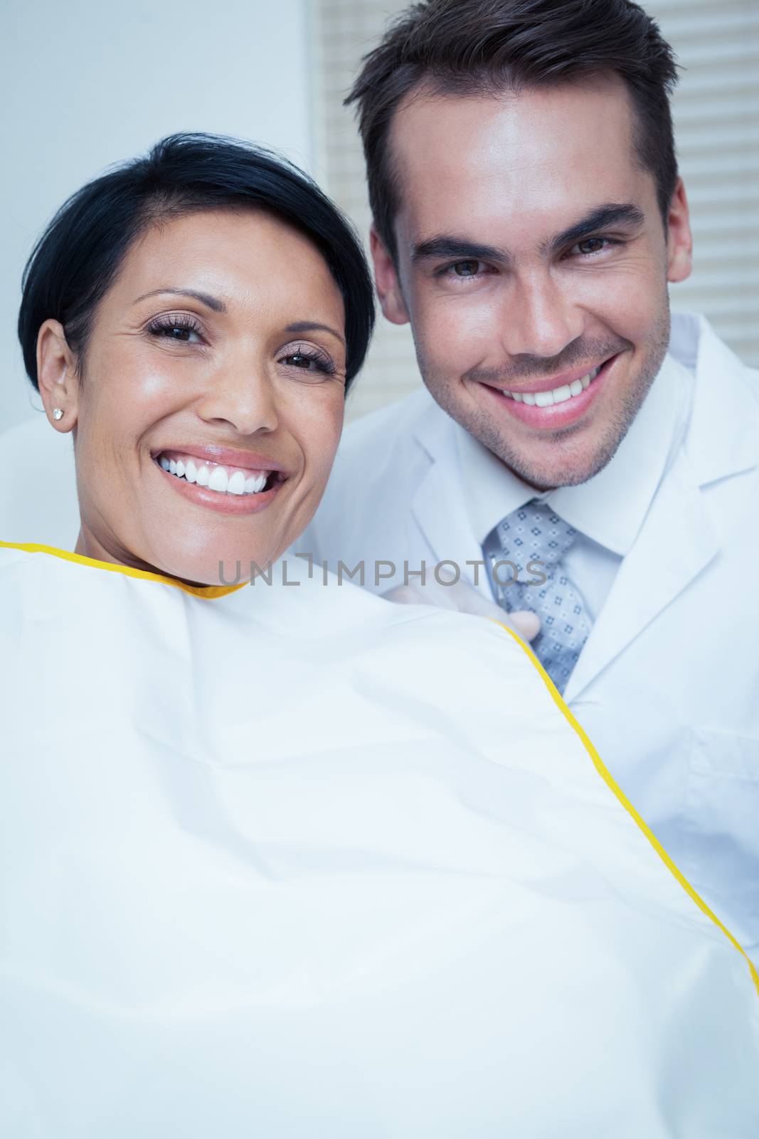 Portrait of smiling young woman waiting for a dental exam