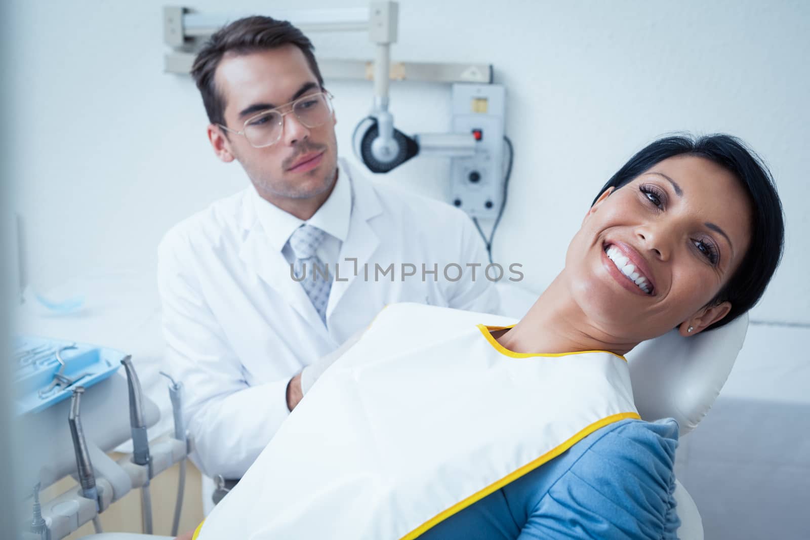 Smiling woman waiting for dental exam by Wavebreakmedia