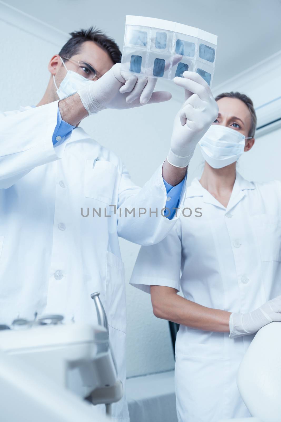Dentists looking at x-ray by Wavebreakmedia