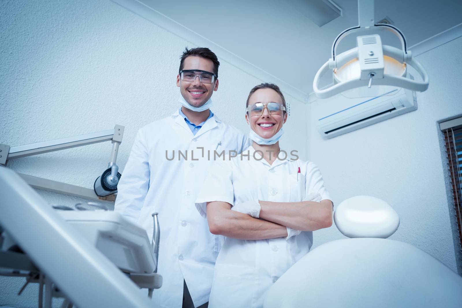 Portrait of smiling male and female dentists