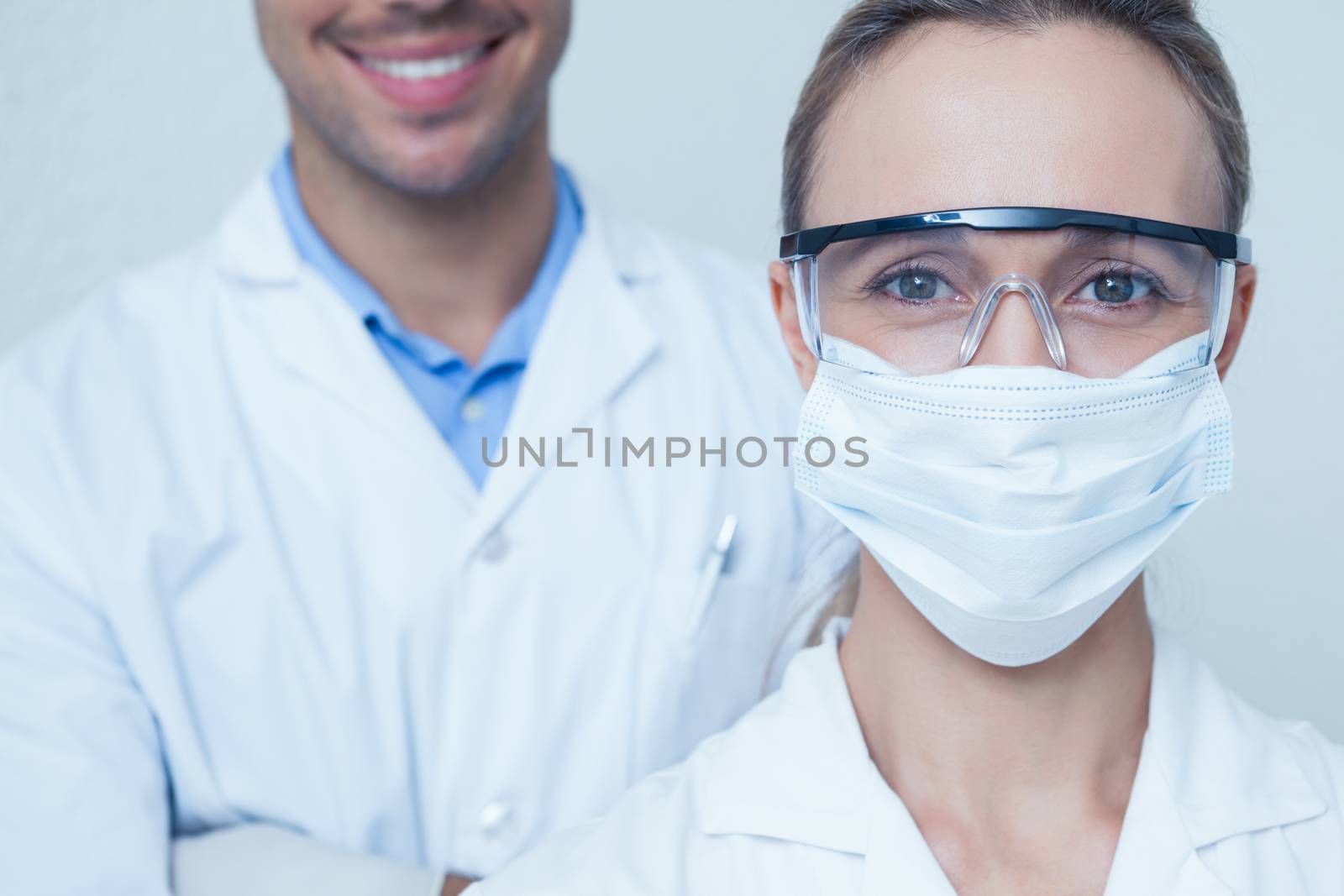 Close up portrait of male and female dentists