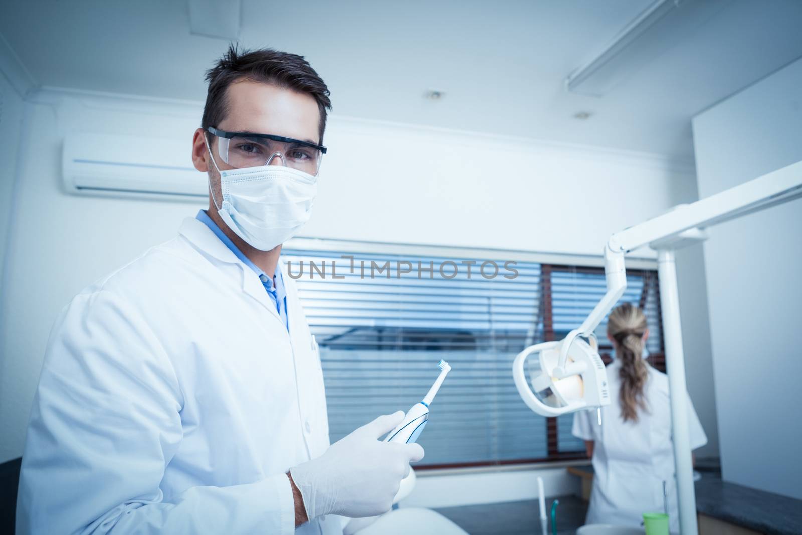 Portrait of male dentist wearing surgical mask