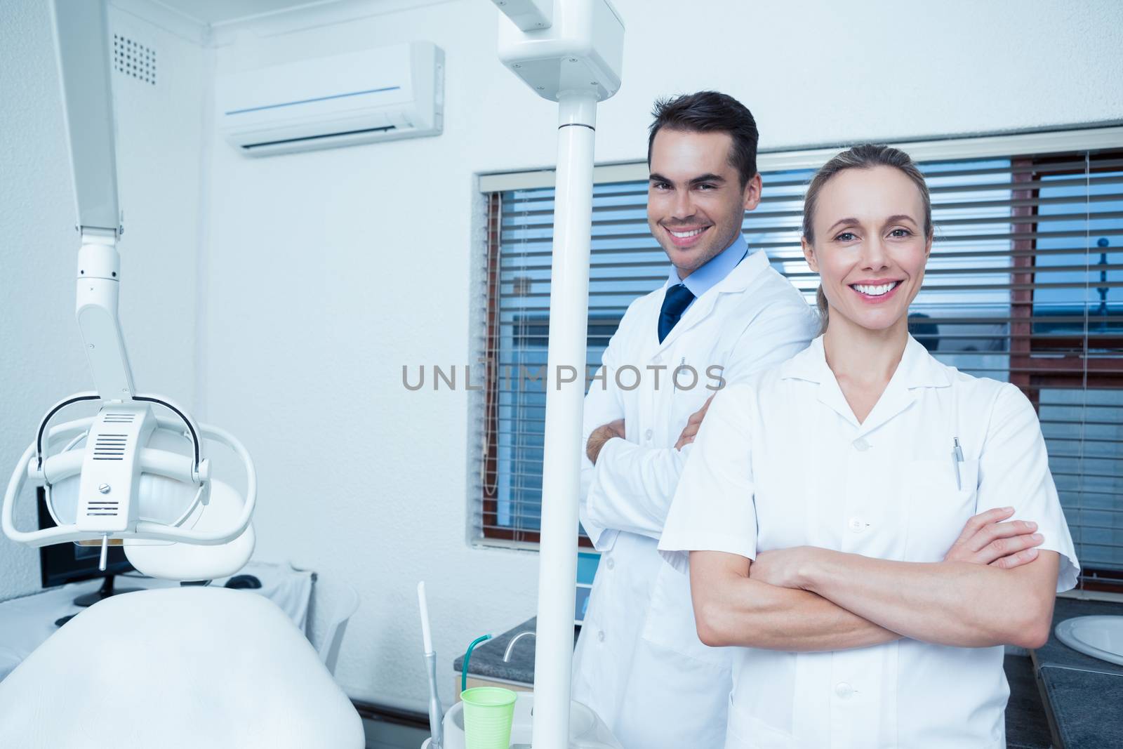 Portrait of smiling male and female dentists