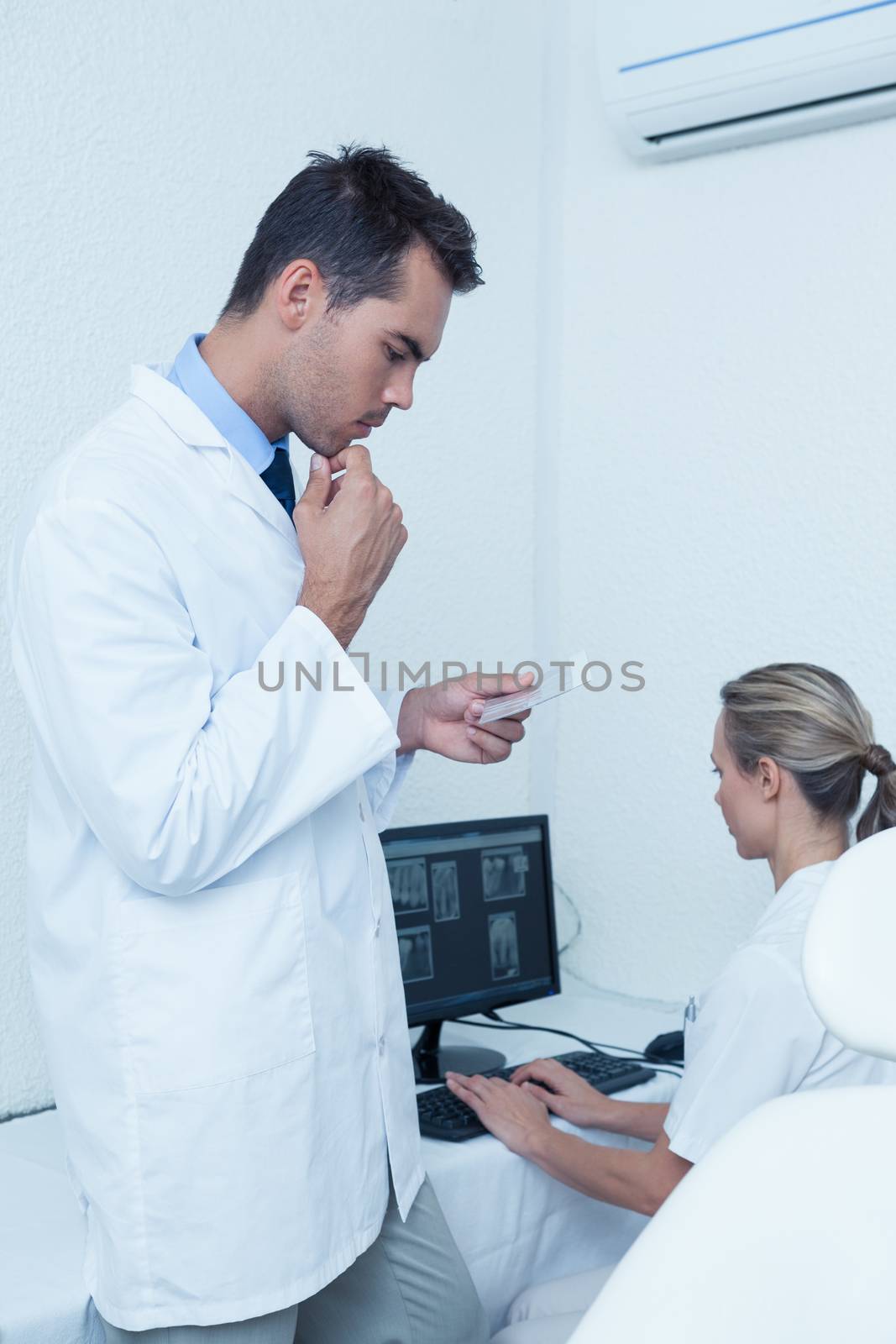 Male and female dentists at work