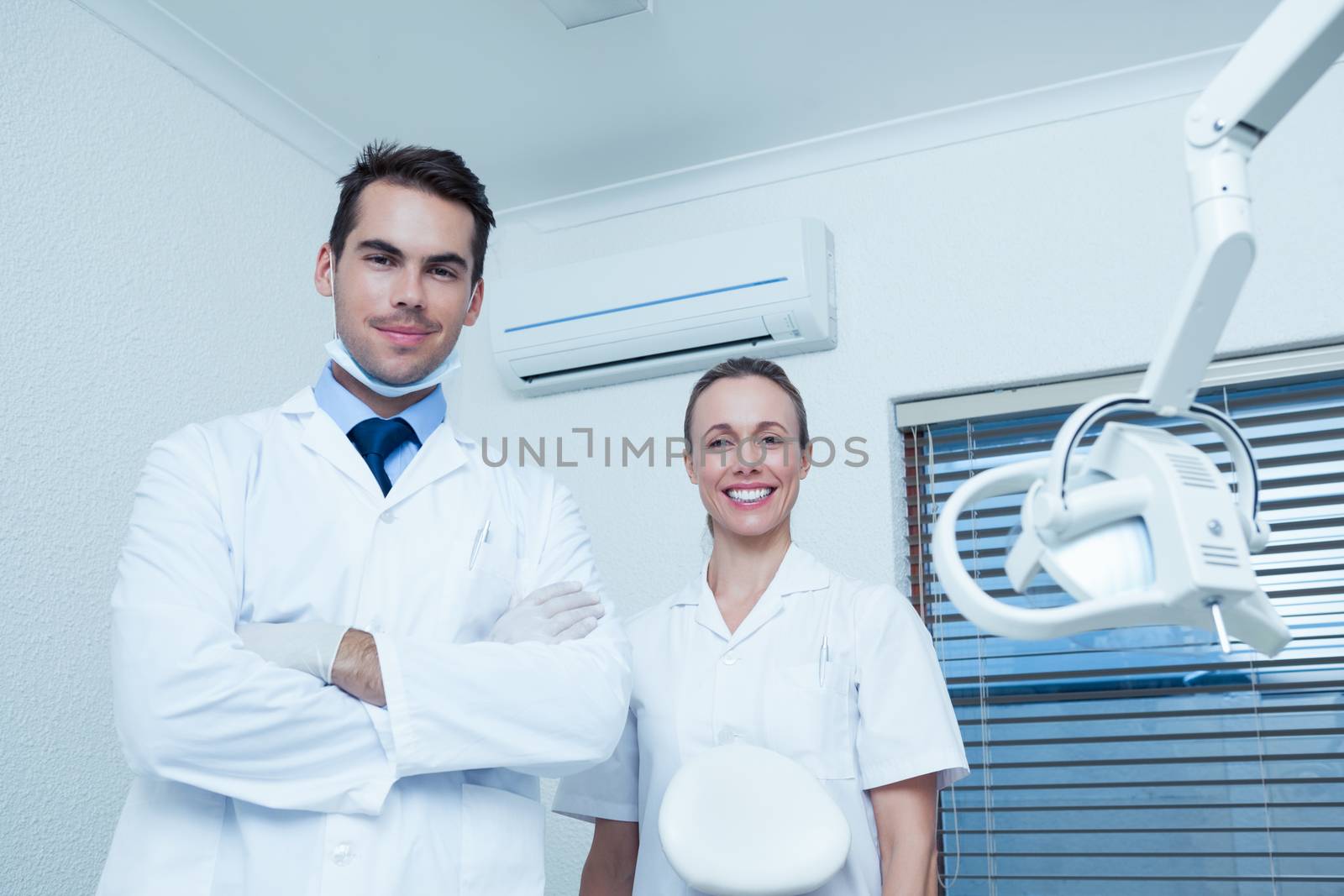 Portrait of smiling male and female dentists