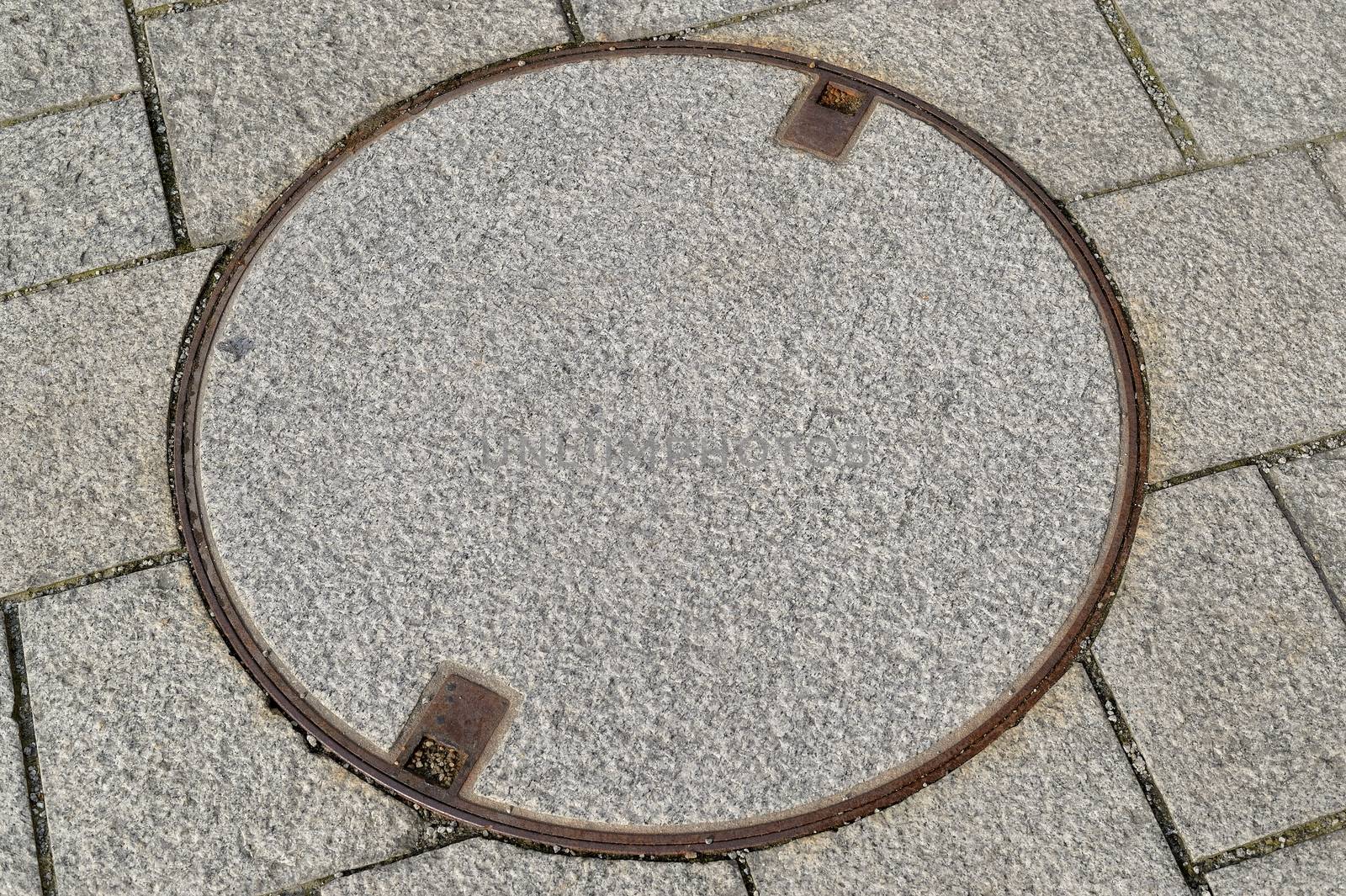 Circular Manhole Cover Set  in the Pavement Stavanger Norway