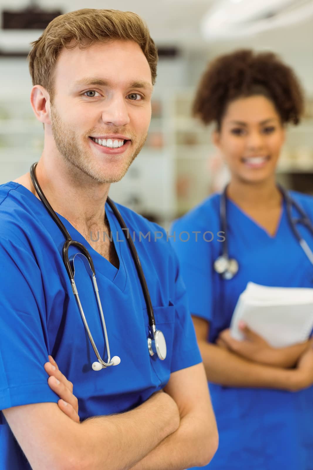 Young medical students smiling at the camera at the university