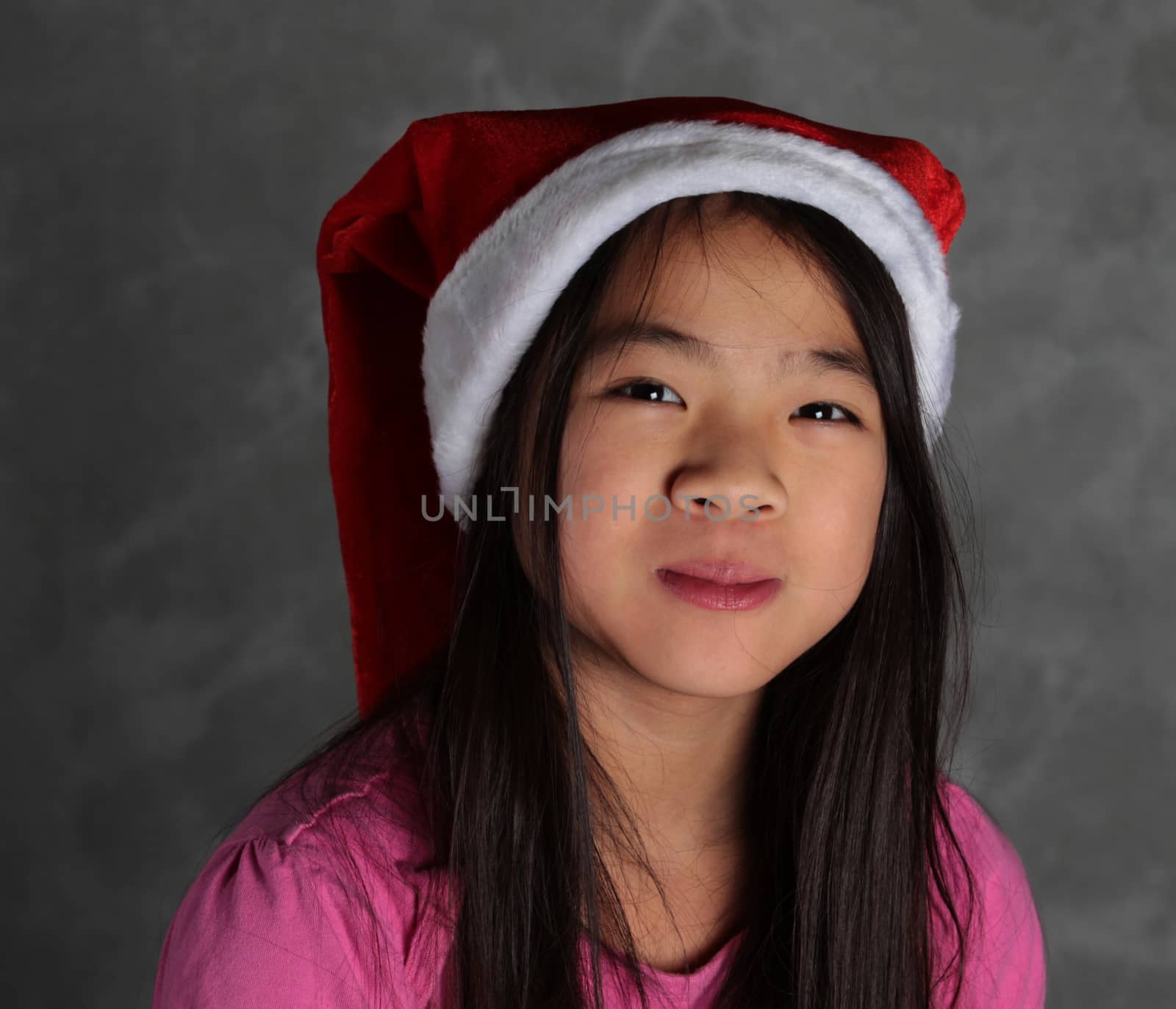 Cute girl smile with christmas  red hat