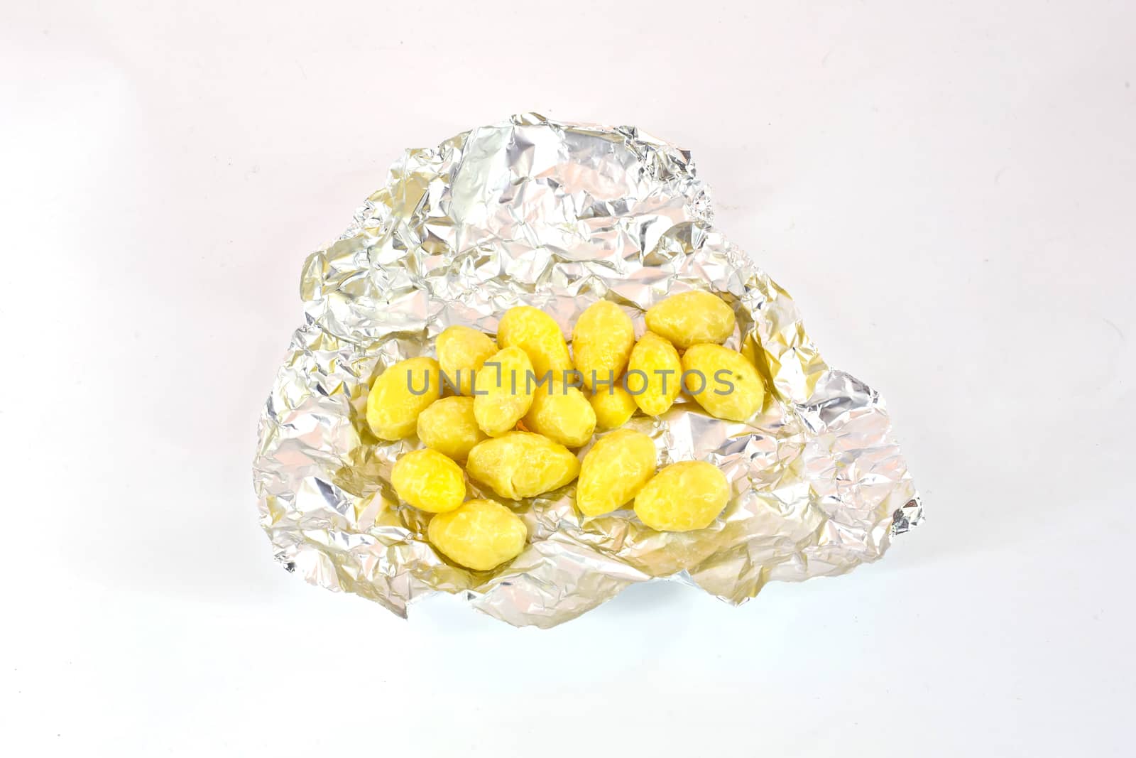 Lotus Seeds on foil isolate on white background